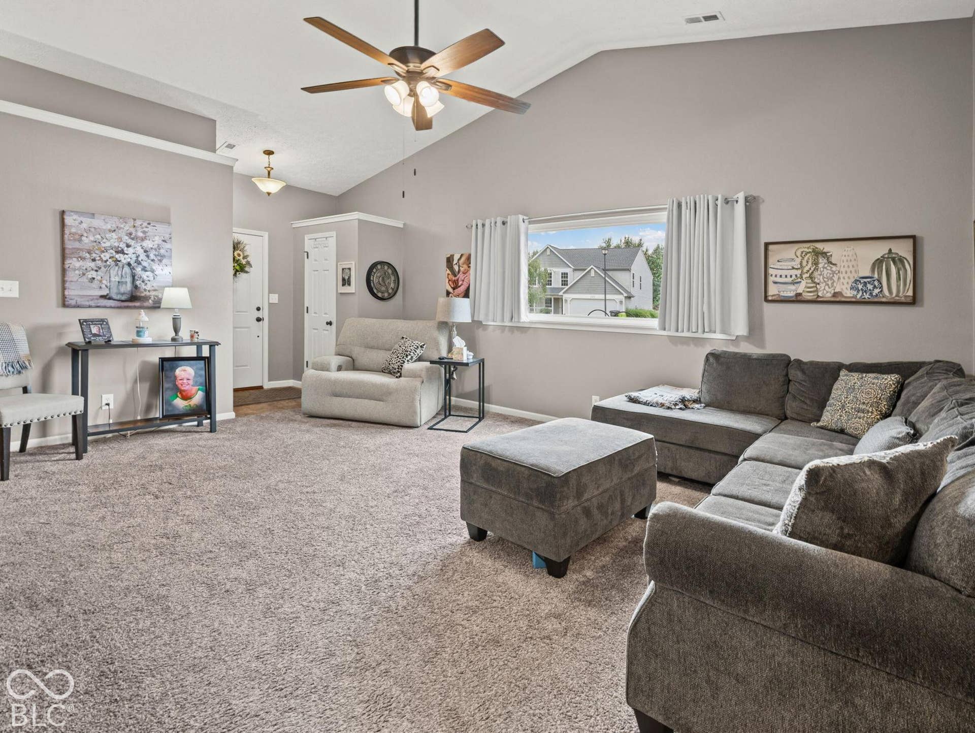 The entrance opens into a large great room with vaulted ceilings