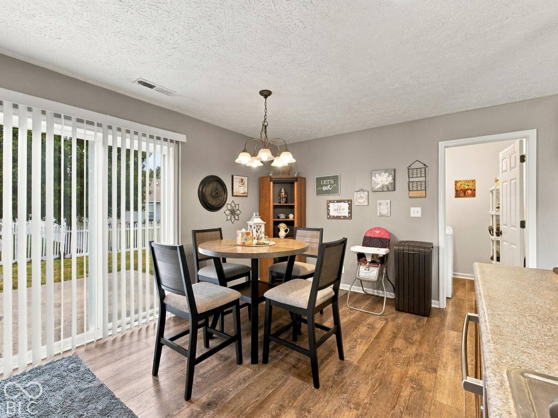 Sliders to the backyard and access to the laundry room are off the kitchen