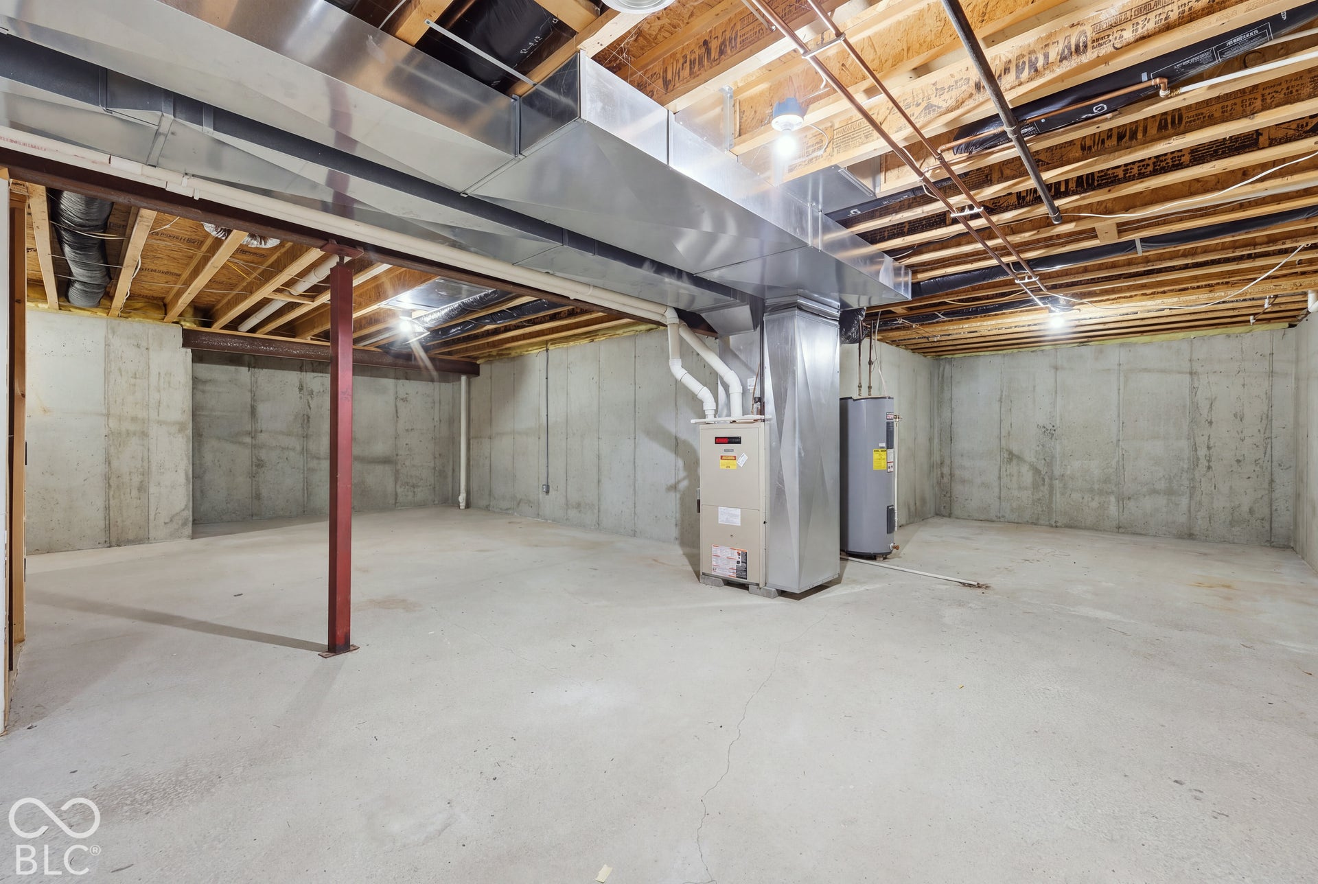 The unfinished walk-out basement offers plenty of room for storage, a workout area, or a future living space. Poured concrete walls and direct access to the backyard add to its possibilities.