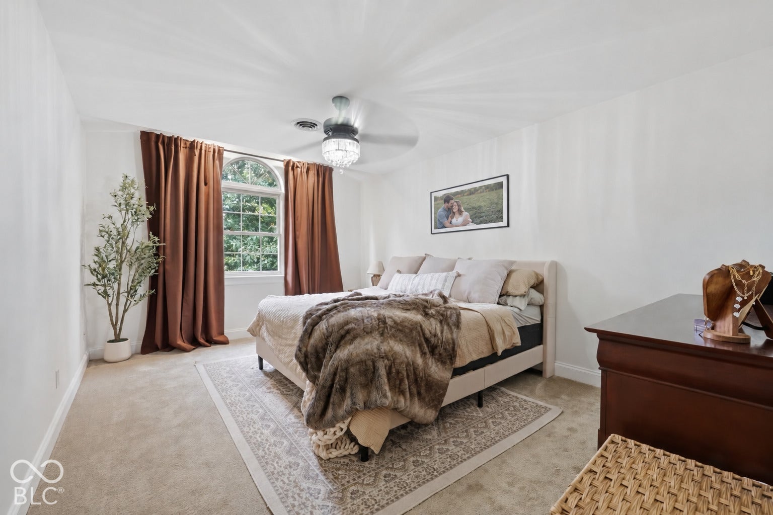 Settle into the cozy 12x22 primary suite, with a beautiful arched window bringing in natural light and outdoor views. A walk-in closet and private bath with double sinks, a standing shower, and Jacuzzi tub complete the space.