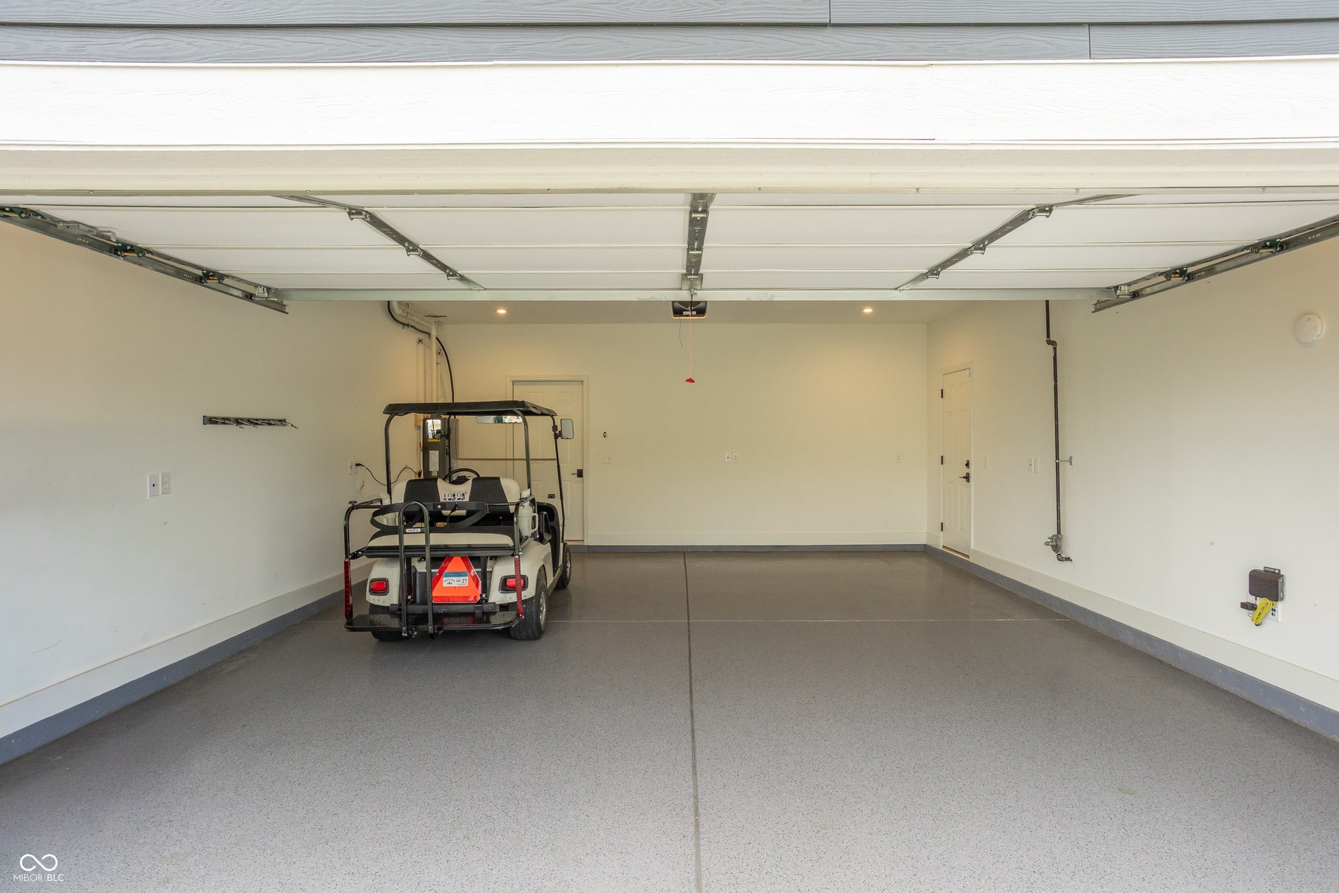 Fully insulated garage, and insulated overhead garage door! Extra long for storage, and has a side access door.