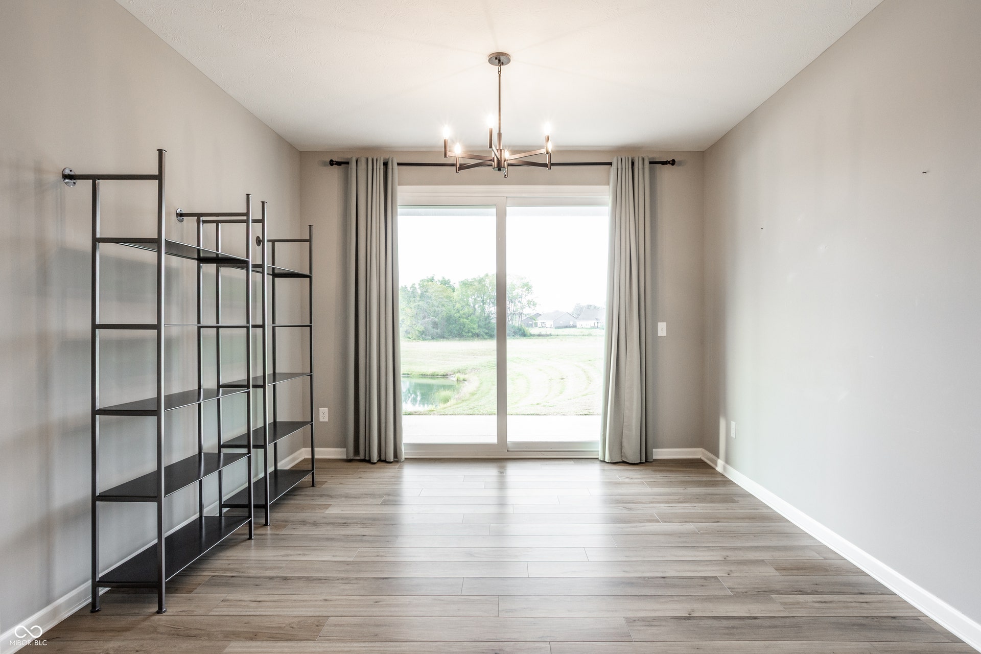 Sliding glass doors that lead to the covered patio