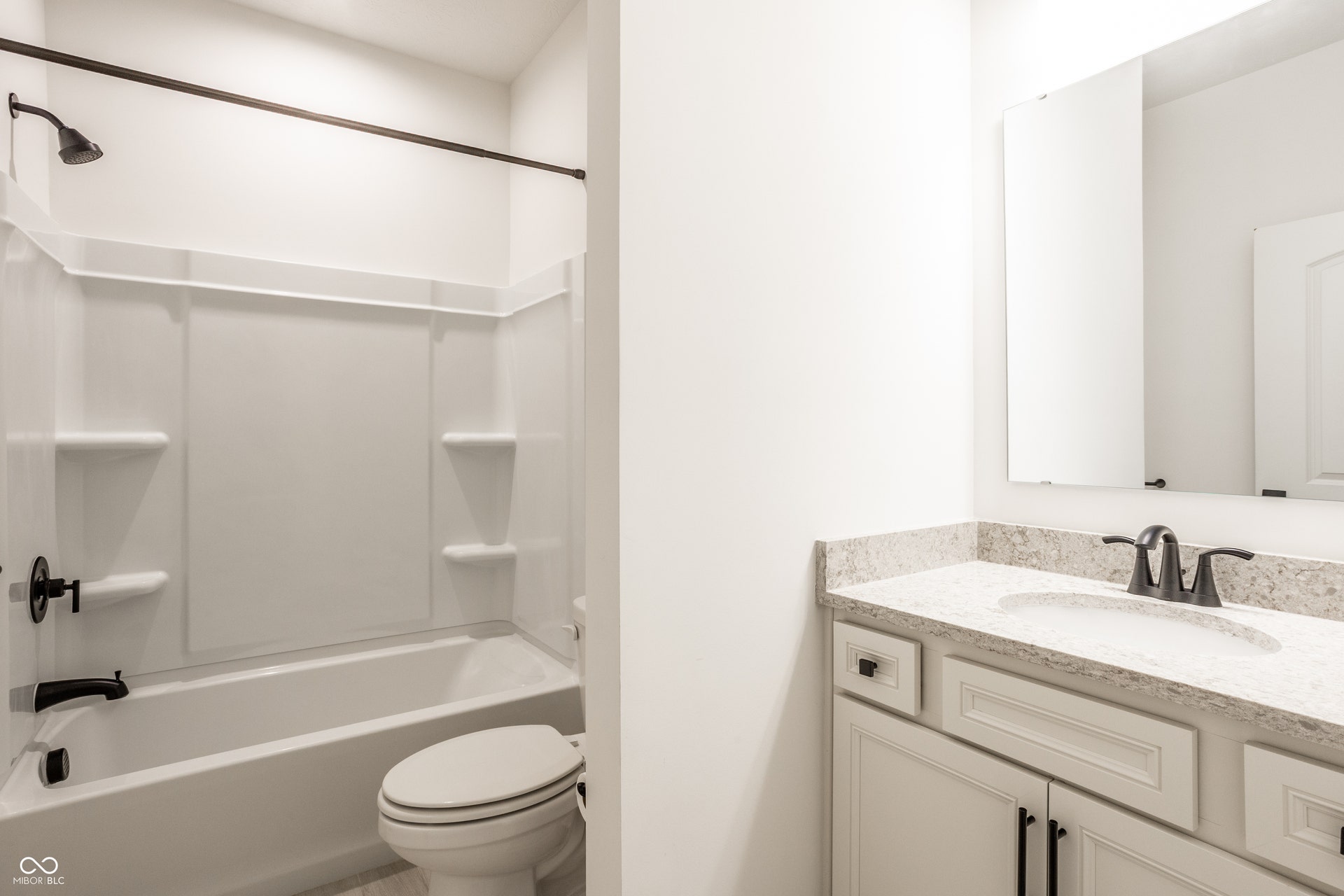 Full bath with tub/shower and quartz counter top