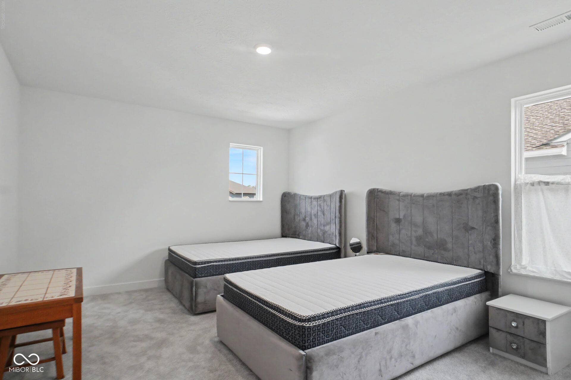 4357 Red Pine Drive, Bargersville, IN 46106 Recessed ceiling lighting illuminates a room with light gray wall paint and matching carpet flooring
