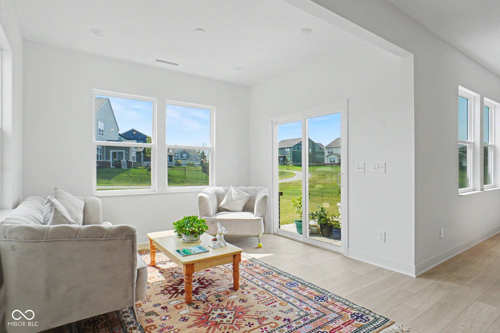 4357 Red Pine Drive, Bargersville, IN 46106 Recessed lighting, wood-finish flooring, white trim, multiple windows, and a sliding glass door