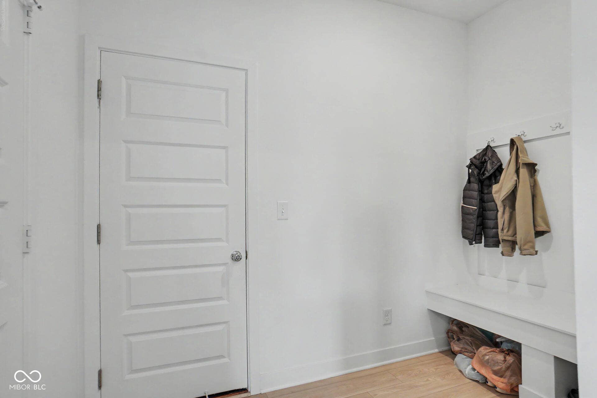 4357 Red Pine Drive, Bargersville, IN 46106 Panel interior door with a built-in bench and coat rack