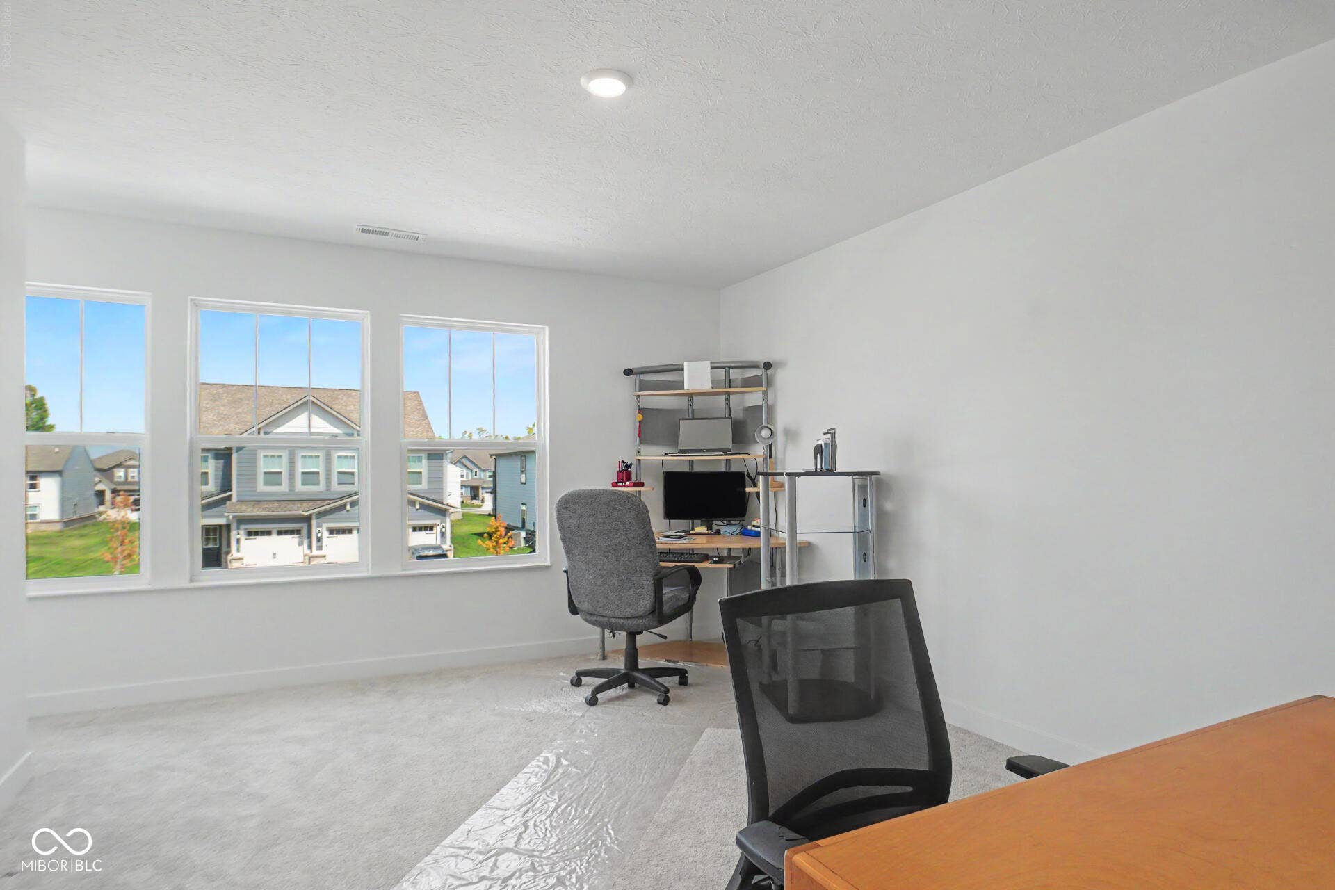 4357 Red Pine Drive, Bargersville, IN 46106 Wall-to-wall carpeting, multiple large windows with white frames, recessed ceiling lighting