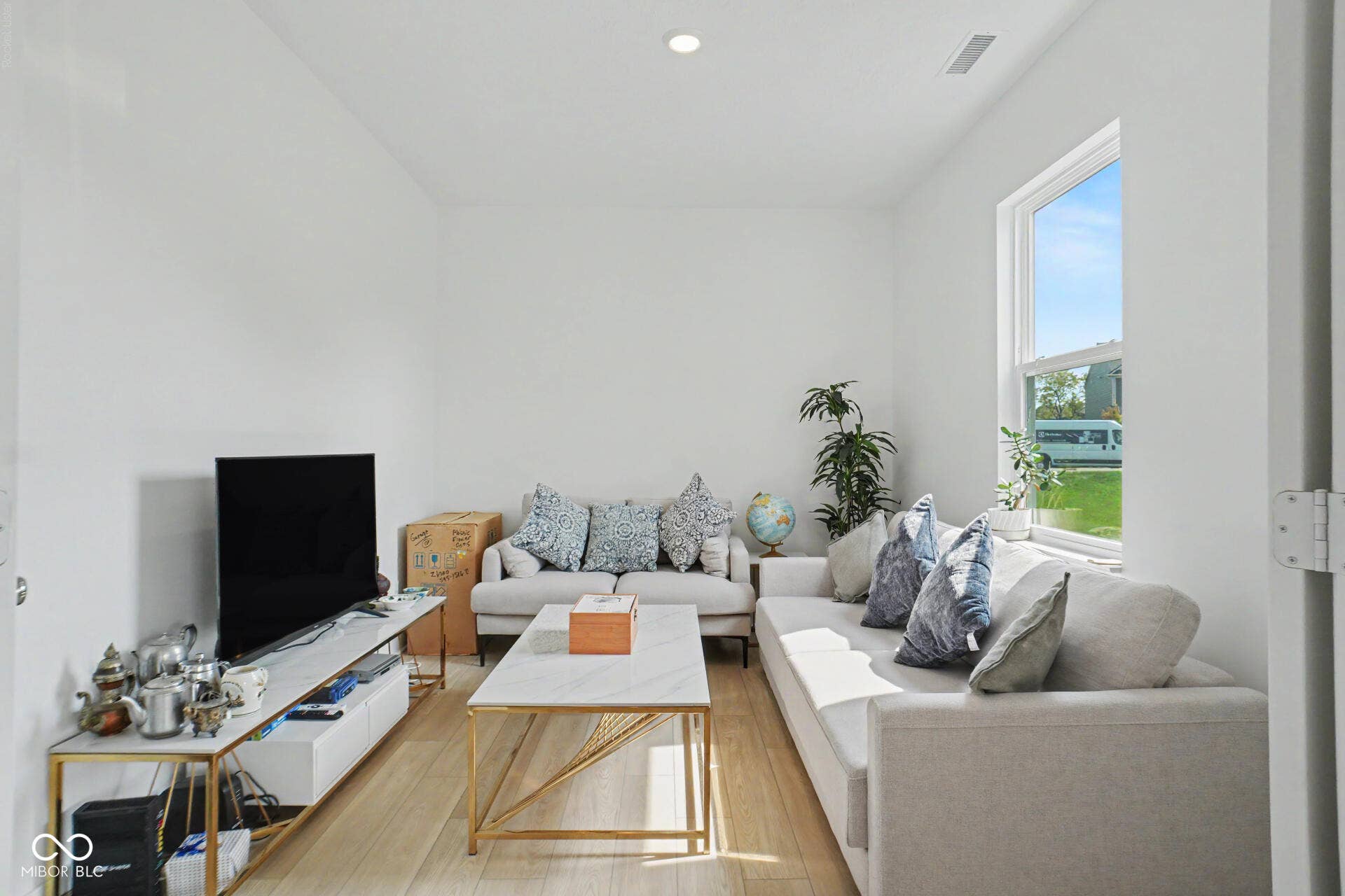 4357 Red Pine Drive, Bargersville, IN 46106 Recessed lighting, wood-finish flooring, and a large window with white trim