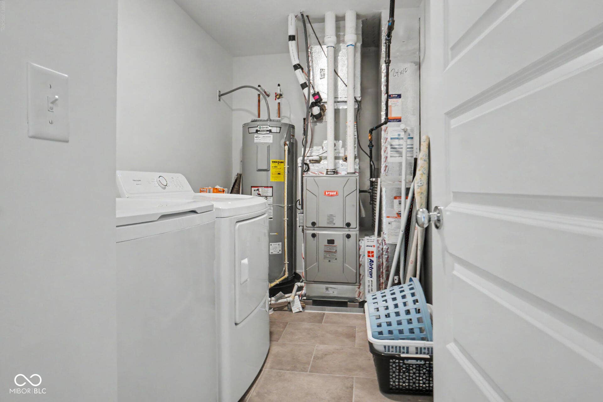4357 Red Pine Drive, Bargersville, IN 46106 Laundry area featuring a water heater, furnace, and tiled flooring
