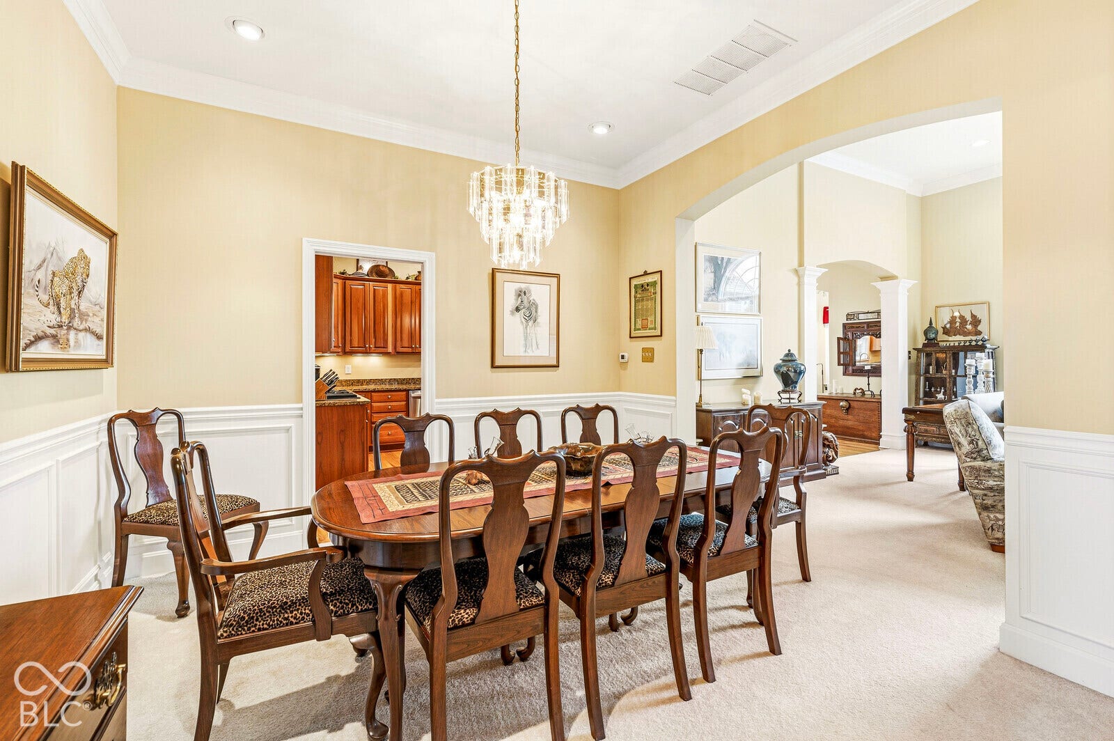 Recessed lighting, crown molding, and wainscoting details