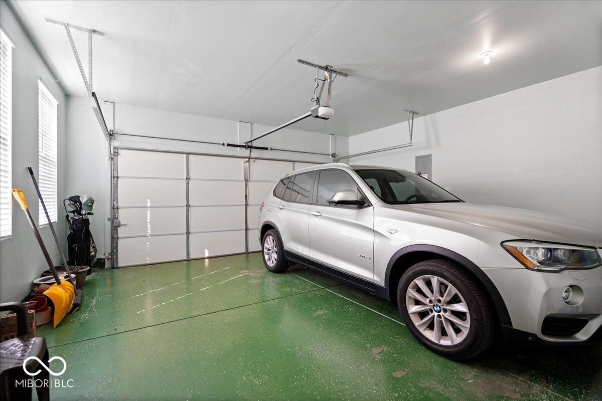 The upgraded garage with painted walls and epoxy floor