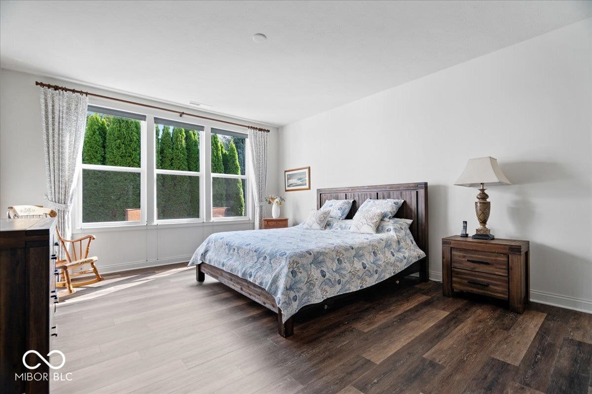 Back inside, the spacious primary suite is located at the back of the home