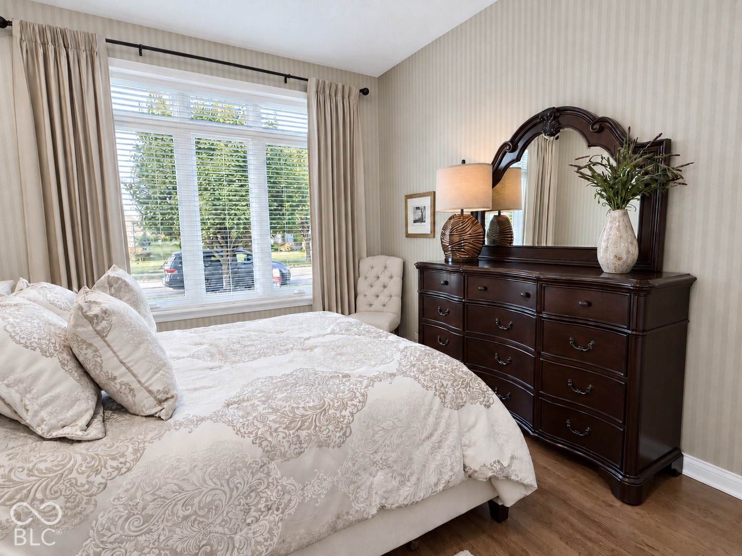 Wood-finish flooring with a multi-pane window and horizontal blinds