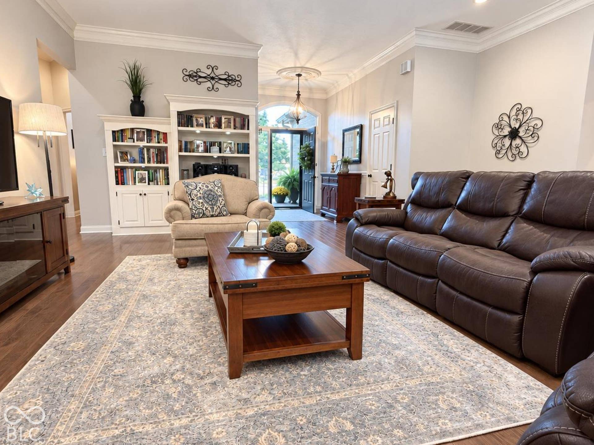 Engineered hardwood flooring throughout, recessed lighting, crown molding, and built-in cabinetry