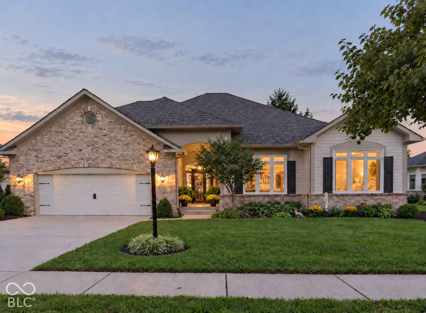 Virtually Altered - Brick and cement board exterior with an arched entry