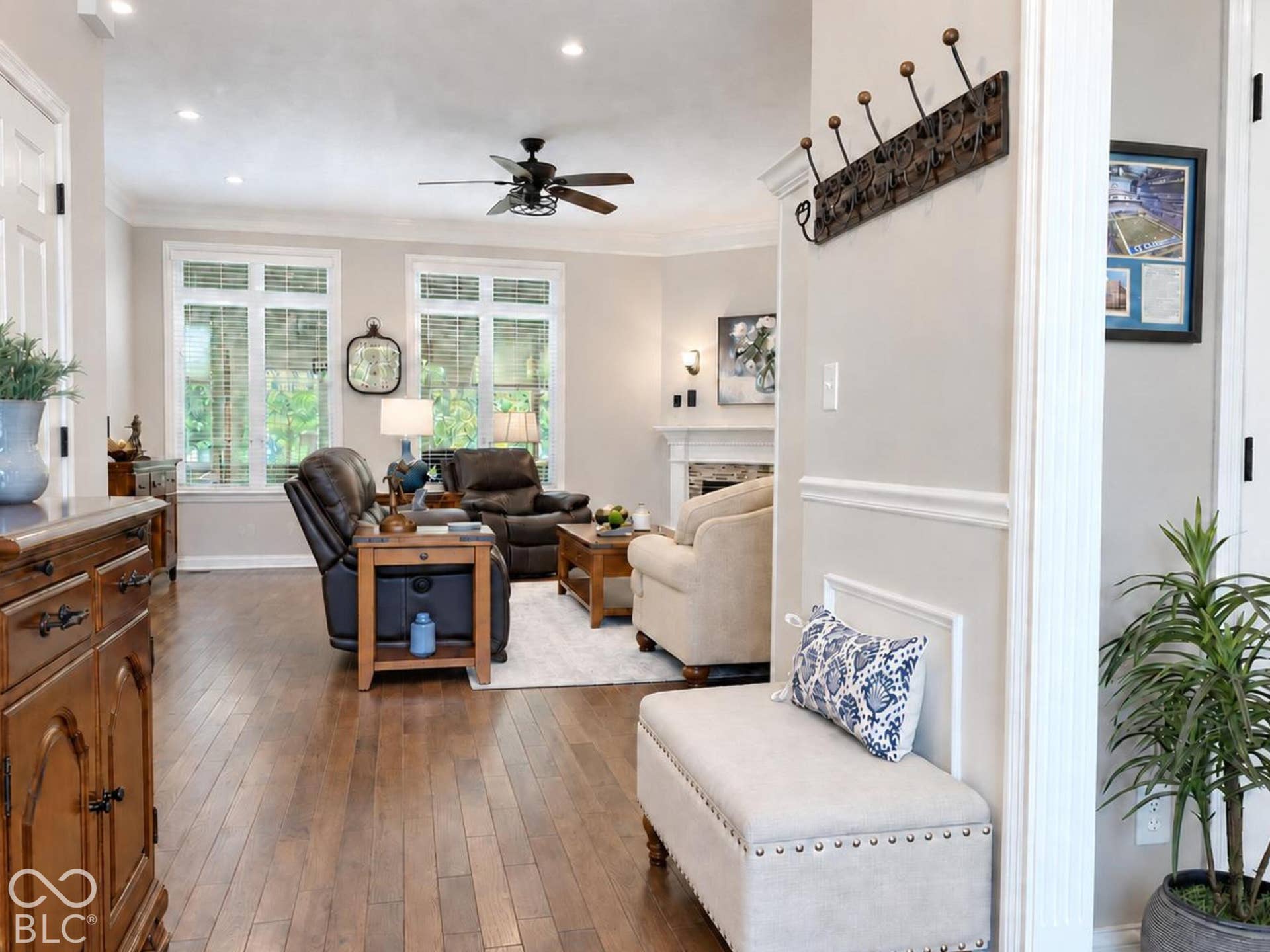 Virtually Altered - Engineered Hardwood flooring, recessed lighting, ceiling fan, newer windows and blinds, crown molding and handsome fireplace.