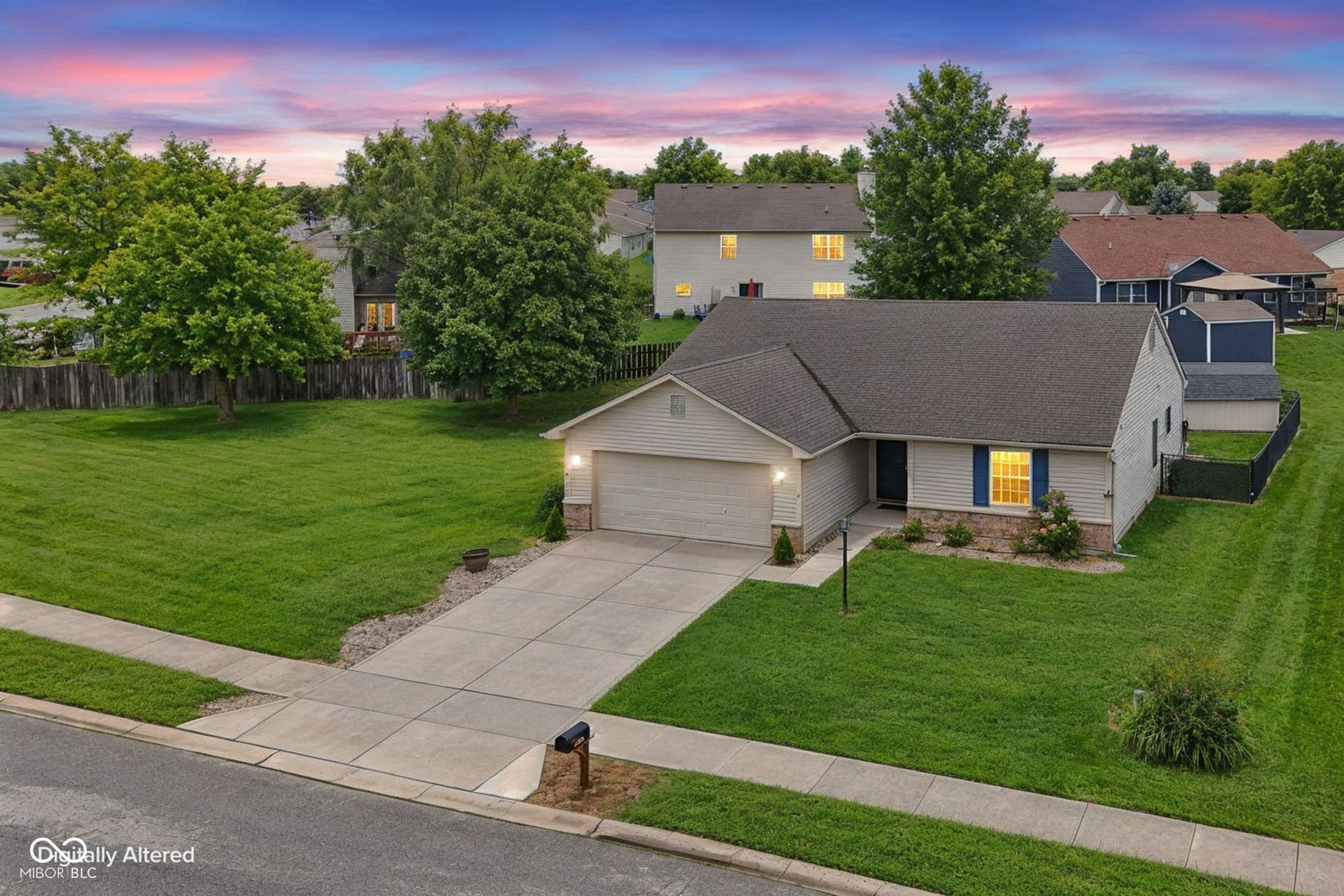 Virtually Altered - Single-story residence featuring light-colored siding, a dark shingle roof, attached garage, and a concrete driveway