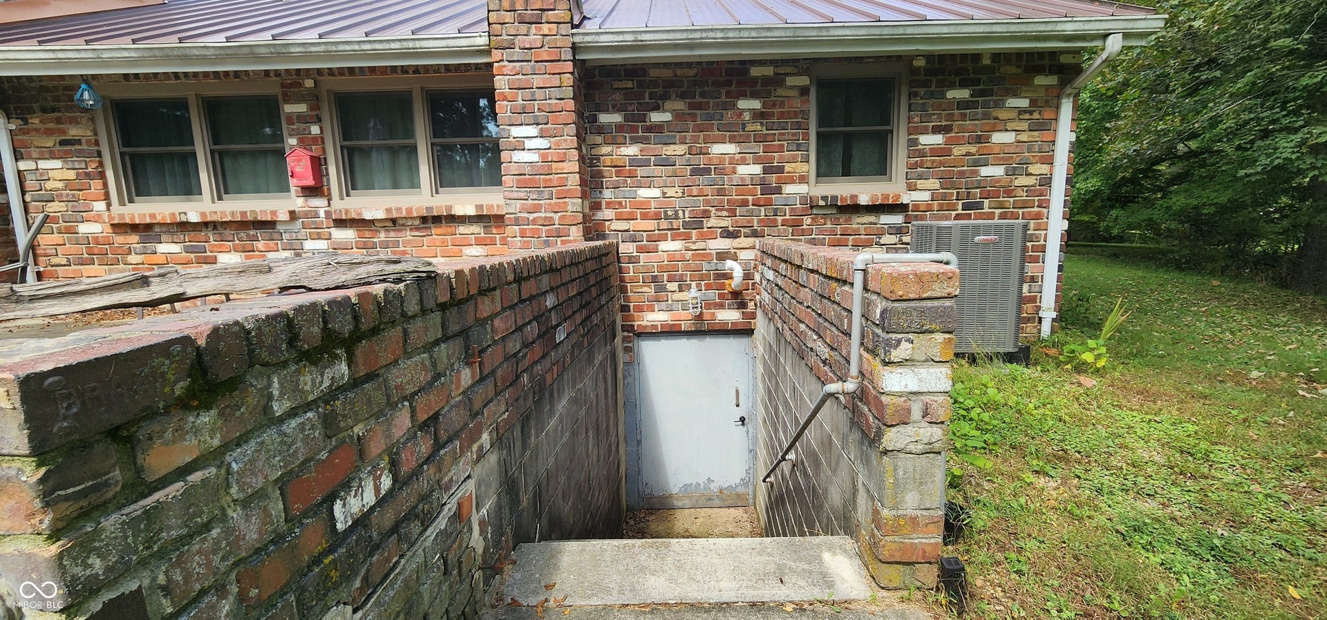 Brick exterior with a metal roof