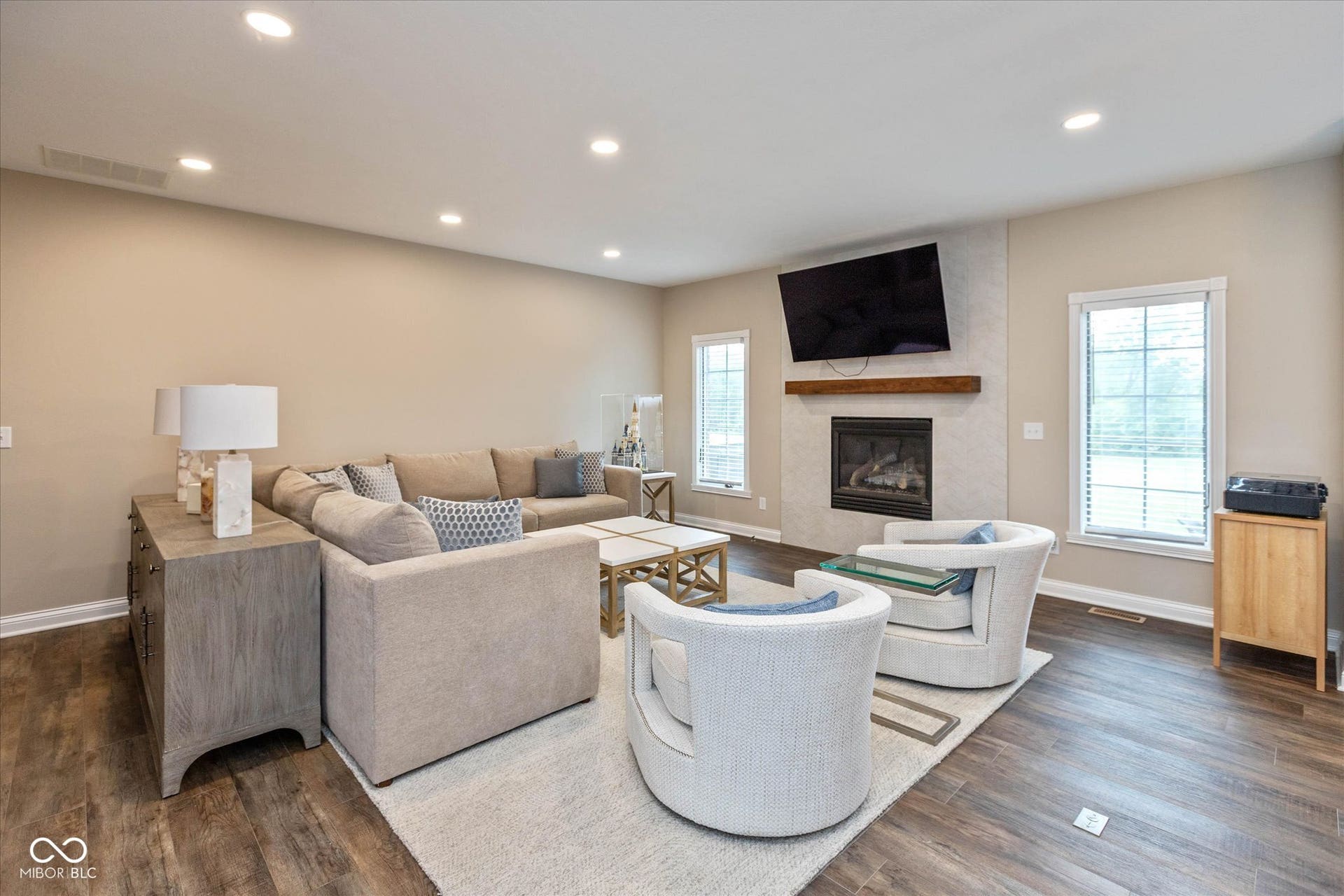 1513 Tottenham, Danville, IN 46122 Recessed lighting throughout, wood-finish flooring, and a fireplace featuring a natural wood mantle and tile surround