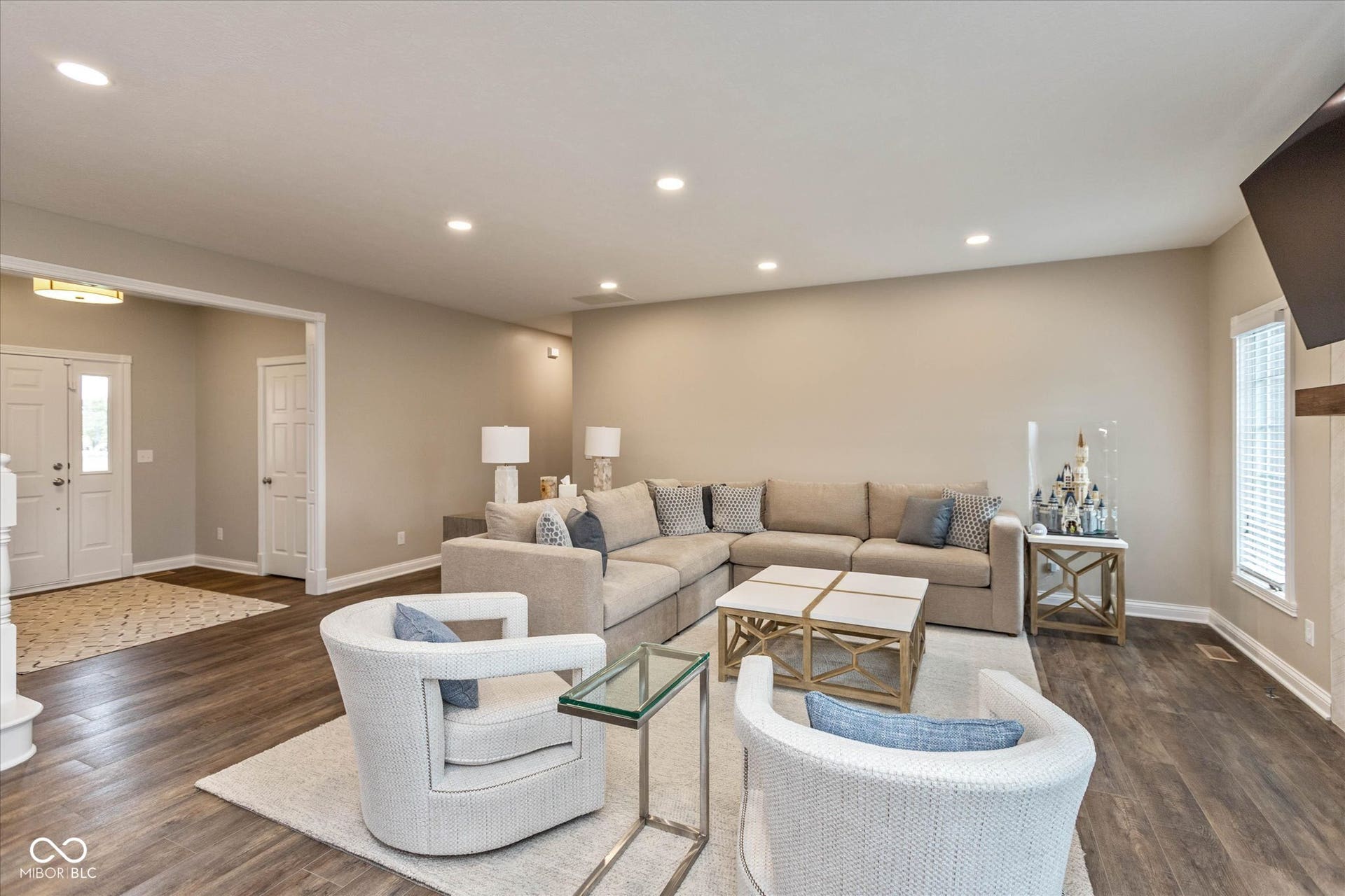 1513 Tottenham, Danville, IN 46122 Recessed lighting, wood-finish flooring, neutral wall tones, white trim, and a white entry door with frosted glass