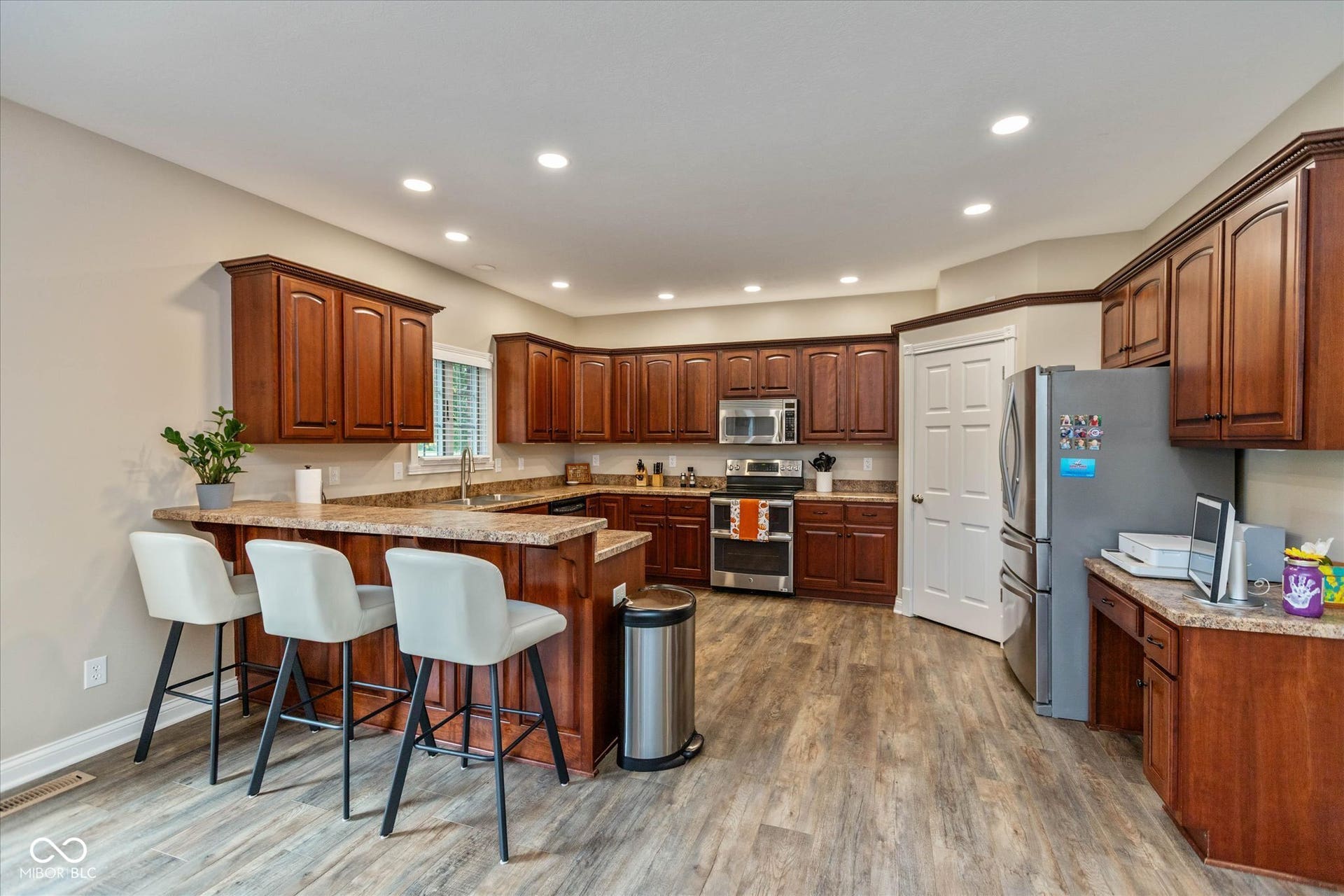 1513 Tottenham, Danville, IN 46122 Expansive kitchen with wood-finish flooring, recessed lighting, stainless steel appliances, and a breakfast bar