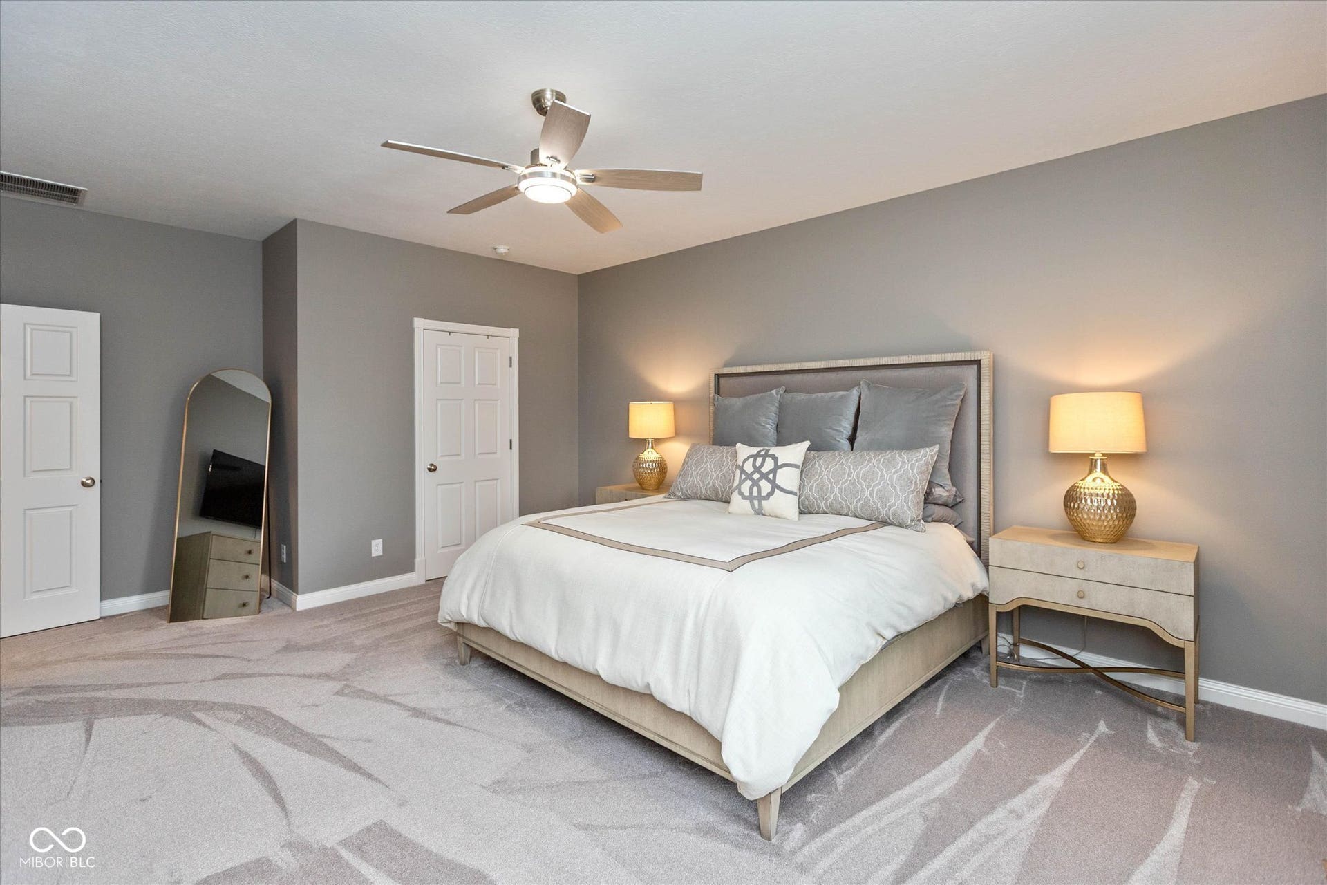 1513 Tottenham, Danville, IN 46122 Plush patterned carpeting, neutral wall palette, three-panel interior doors, and a ceiling fan with integrated lighting