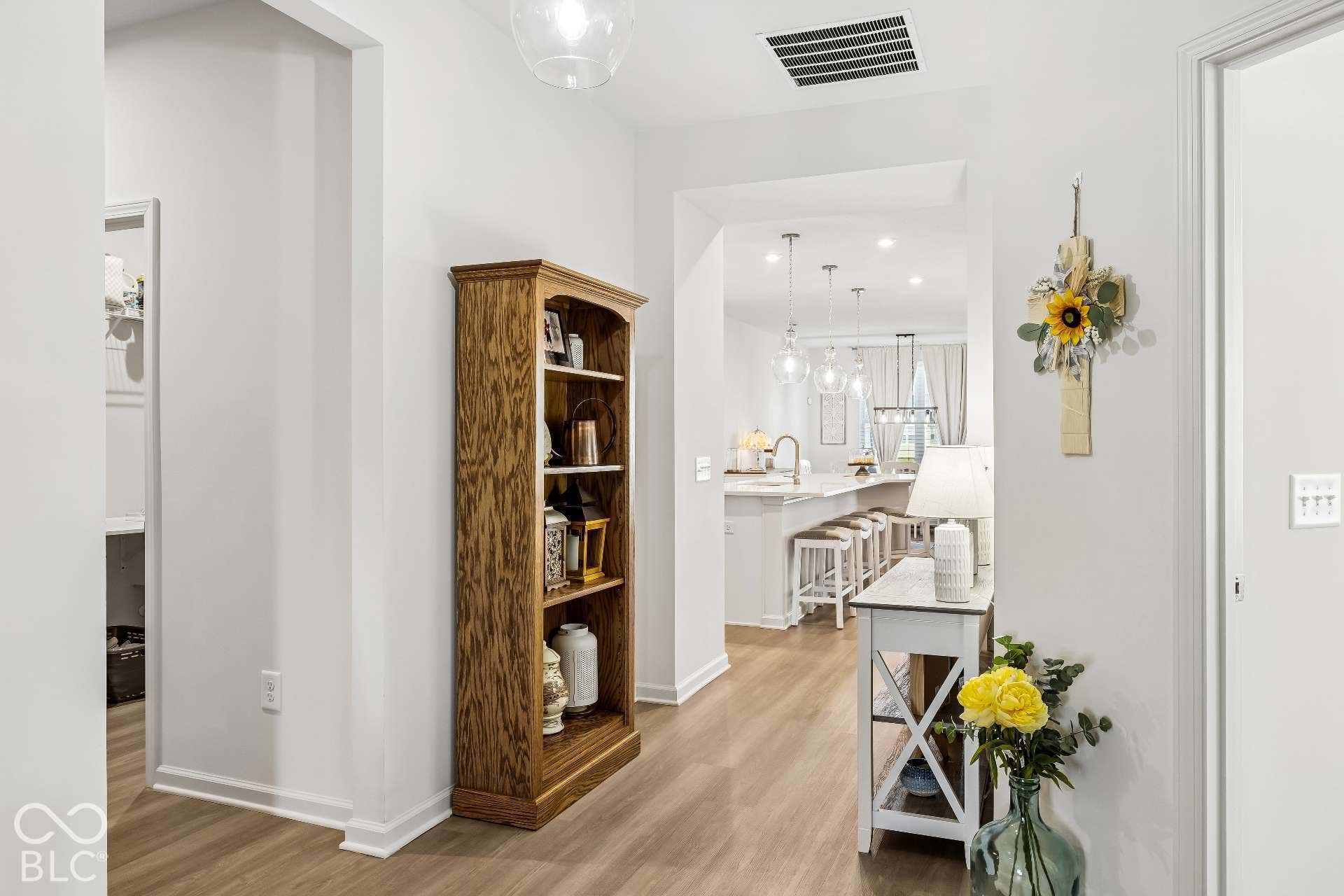 Wide plank wood-finish flooring throughout