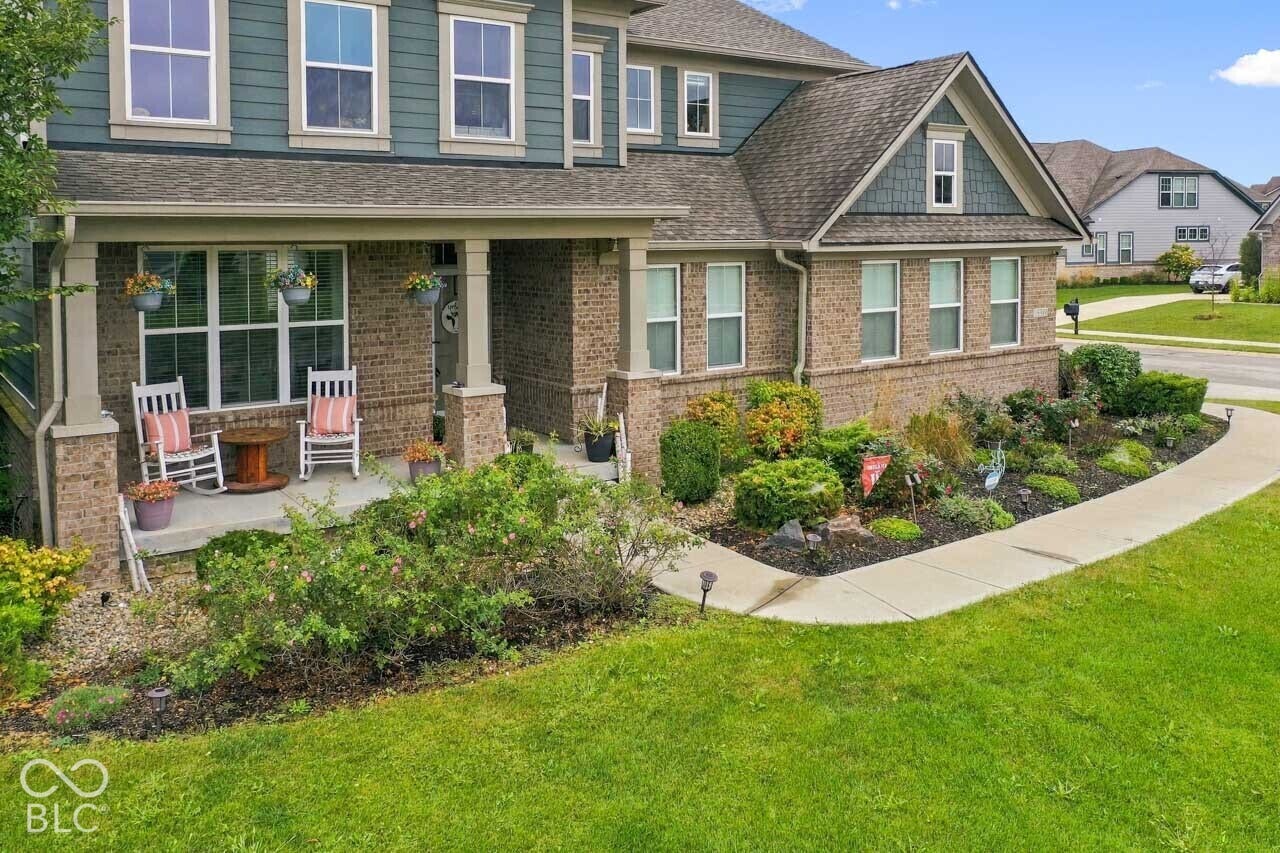 Brick and siding exterior with a covered front porch