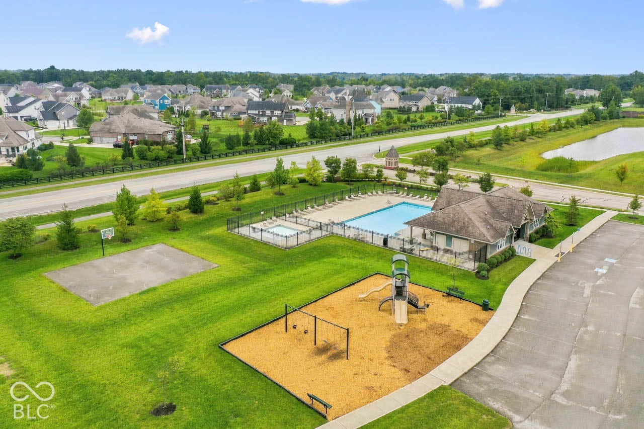 Community amenities featuring a swimming pool, separate spa, and dedicated pool house