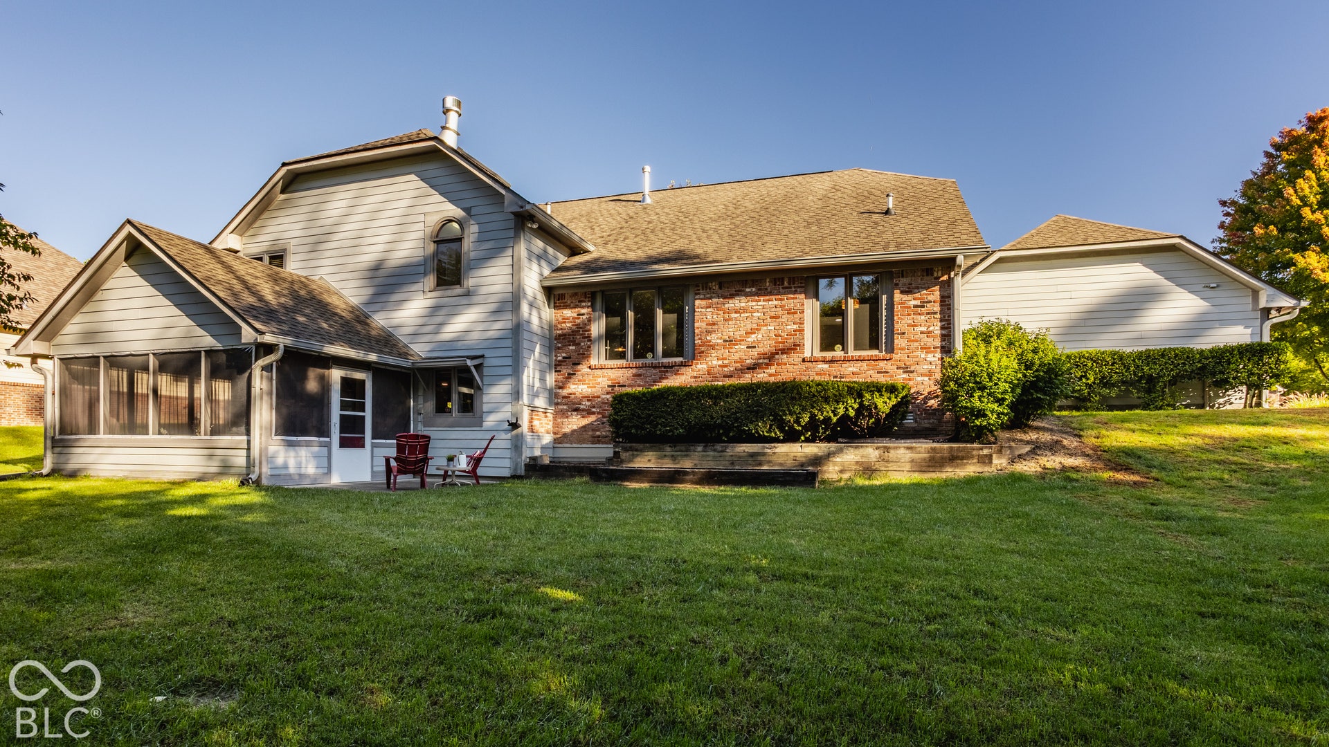 Custom home with walk out basement apartment featuring a screened-in porch, siding with life time warranty, mature landscaping, garden beds, and fruit trees: nectarine, plum, peach, and lemon.