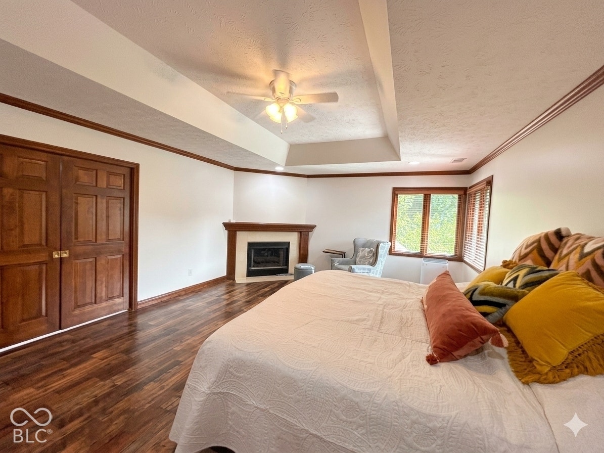 Virtually Altered - Beautiful double pocket doors lead to the ensuite bathroom. Virtually altered: belongings removed and imaged lightened.