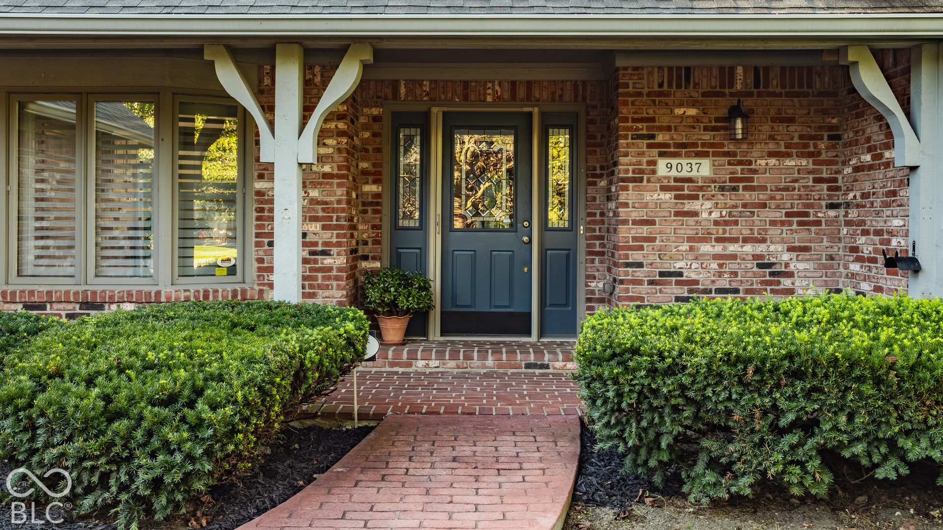 Welcome home to a north facing covered front porch.