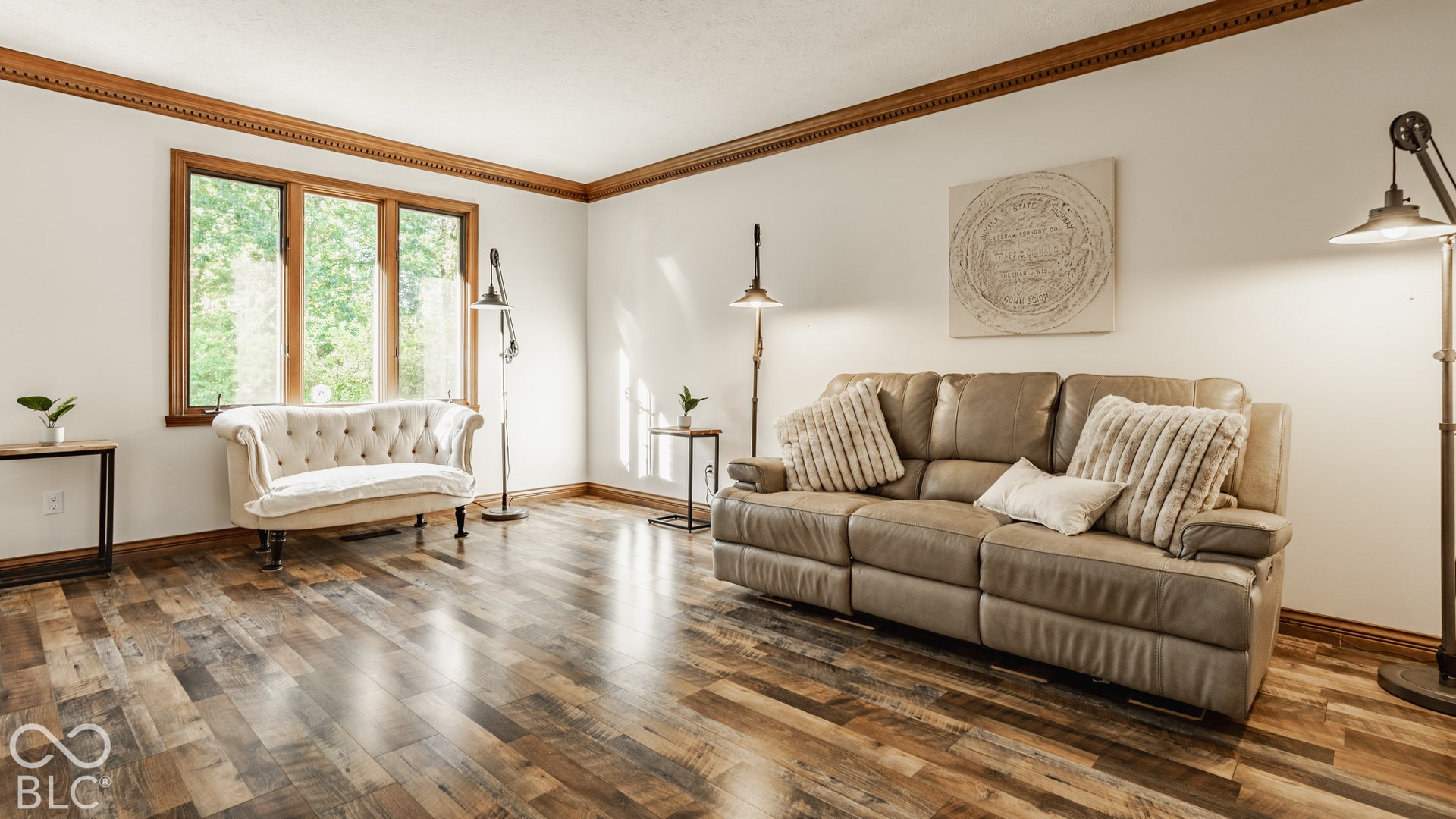 Soak in the natural views of the woods from the step down living room.