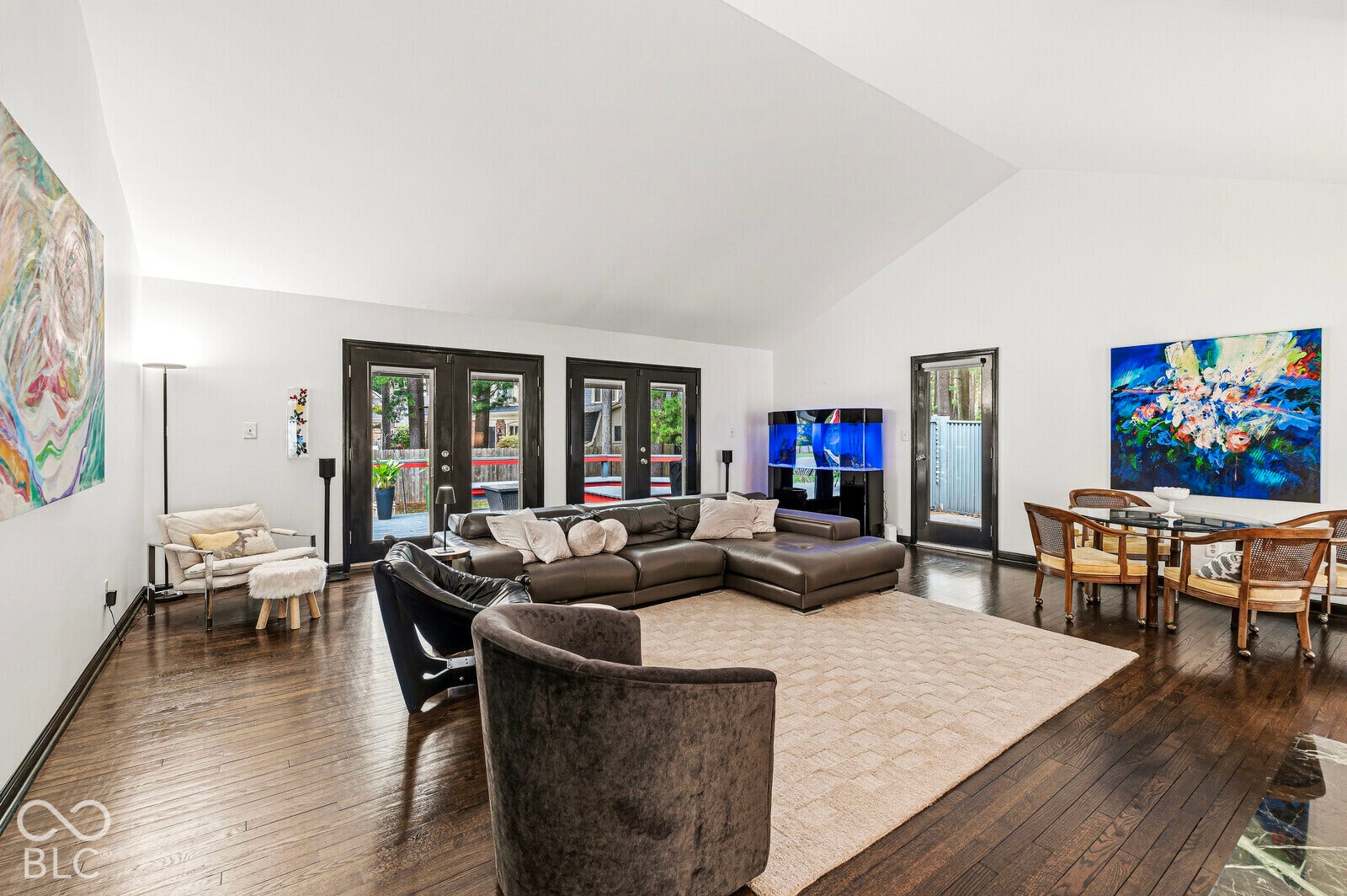 7622 Silverpine Court, Indianapolis, IN 46250 Spacious, light-filled gathering space features a pitched ceiling, expansive west-facing glass doors and cozy gas fireplace. Direct access to deck and courtyard.