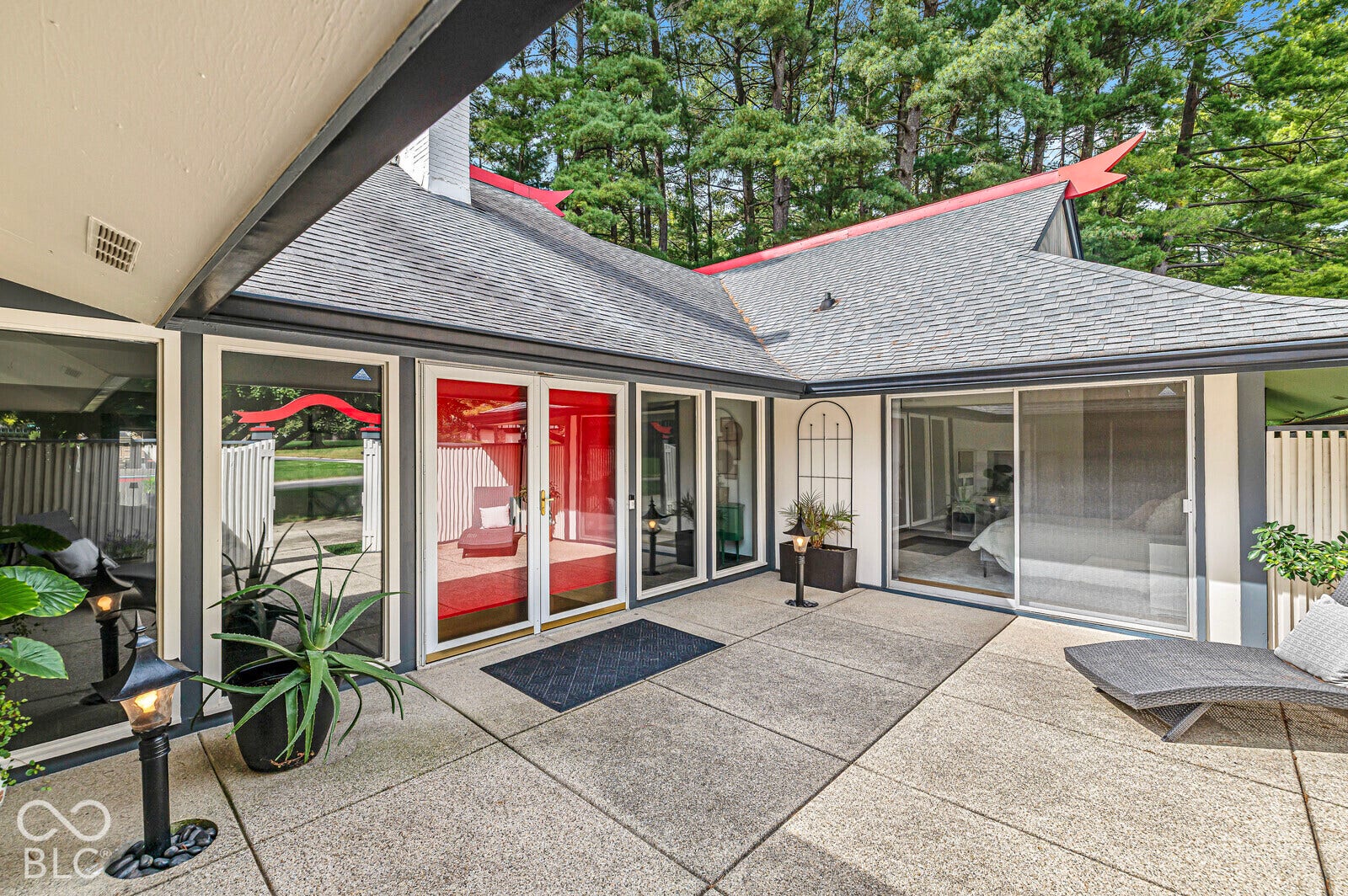7622 Silverpine Court, Indianapolis, IN 46250 Enclosed entry courtyard sets the tone for this one-of-a-kind residence. Property is full of windows that allow natural light to flood through the home. Glass doors and windows to the dining room, entry and bedroom 2.