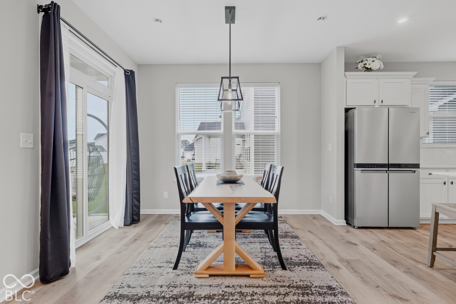 Light-filled dining space with new light fixture