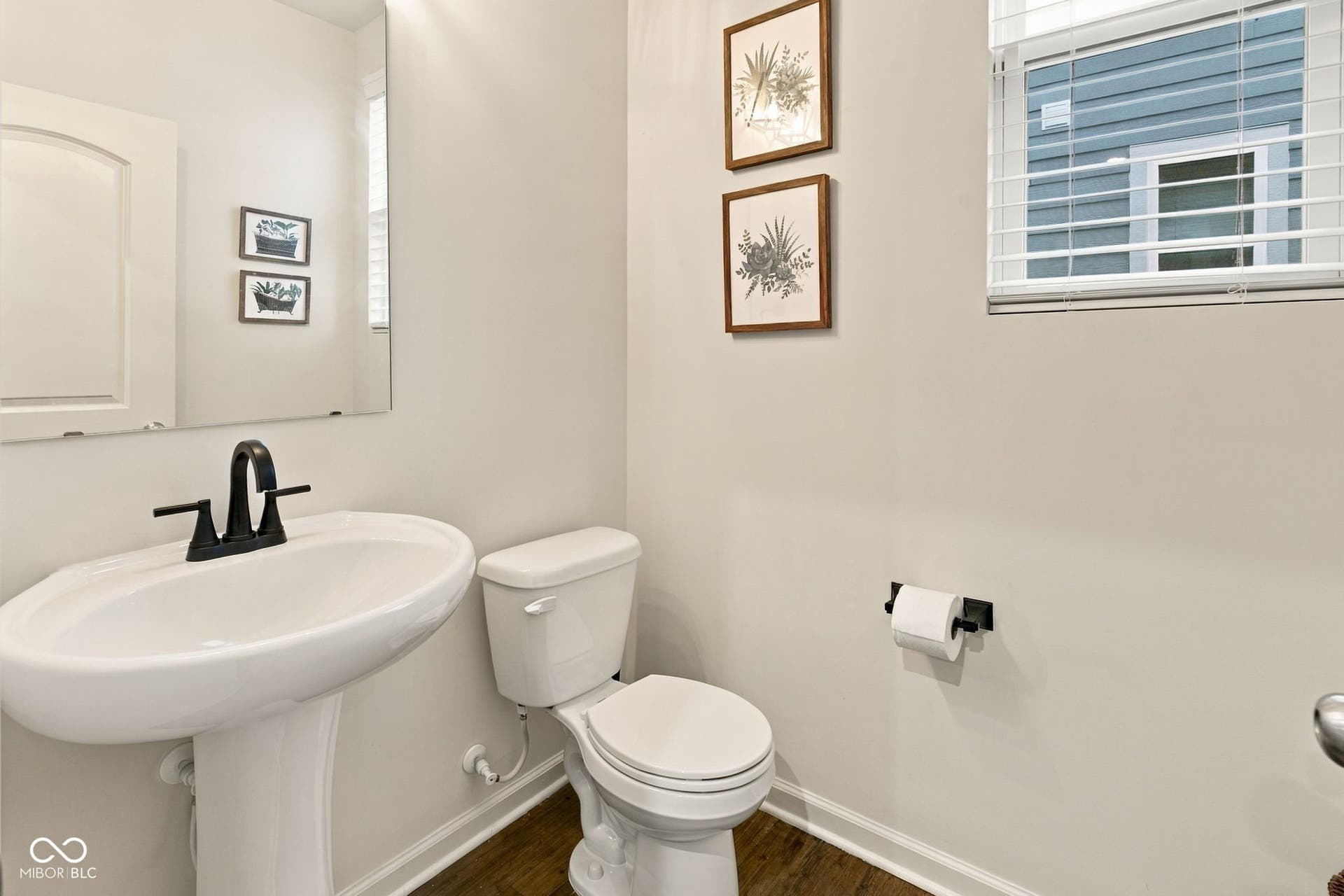 Half Bath w/ Pedestal sink & LVP flooring