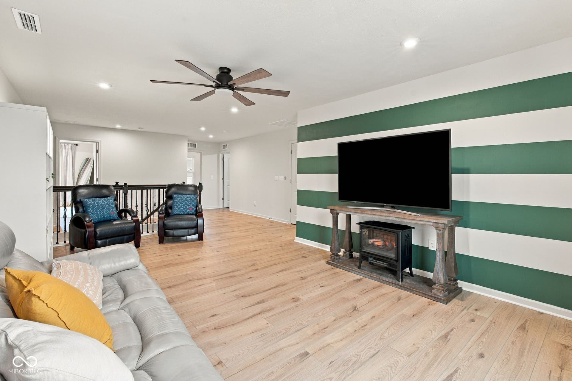 Upper Level Loft with LVP flooring, recessed lighting, and a ceiling fan