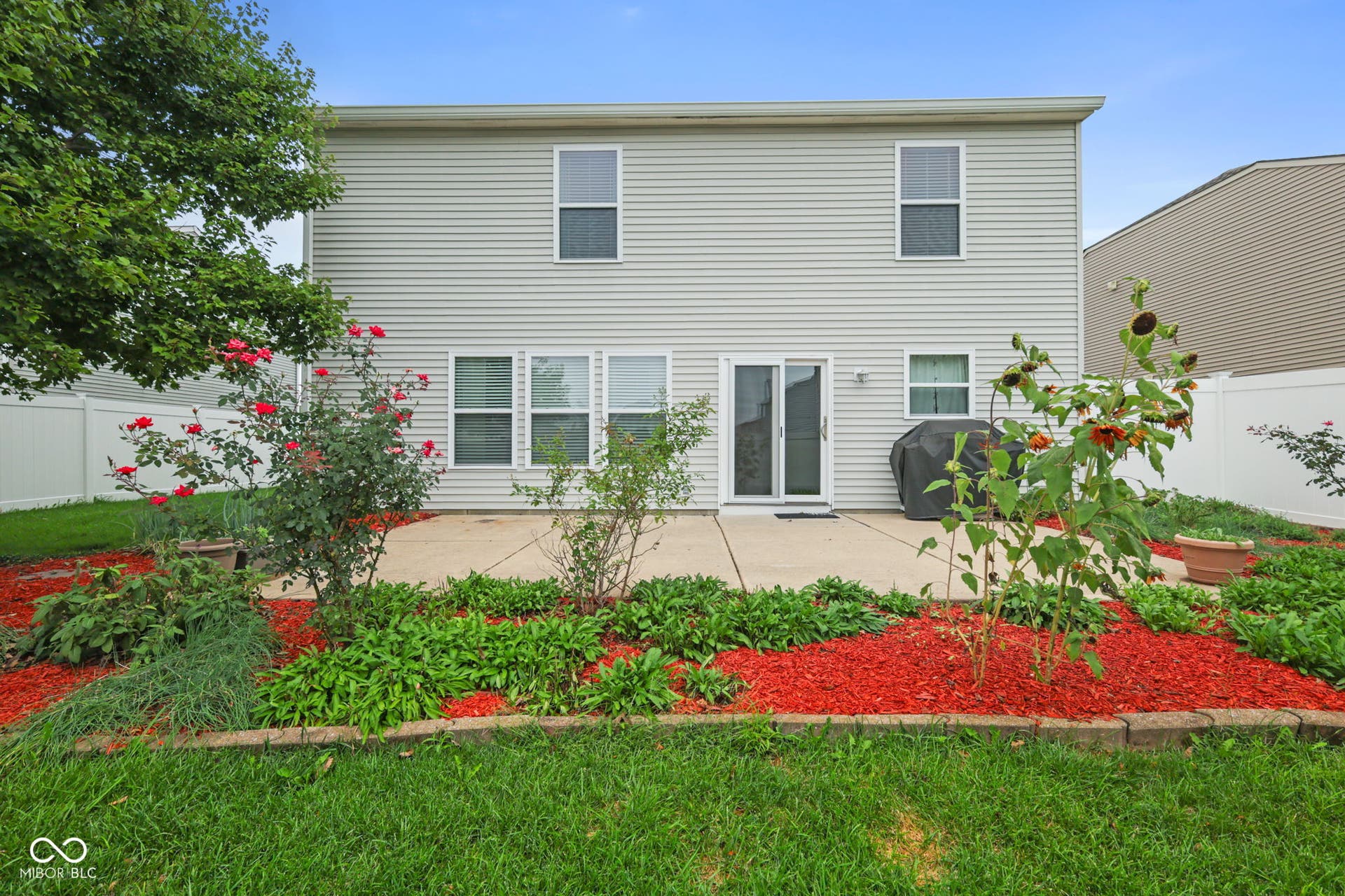 full privacy fenced in backyard with tons of perennials