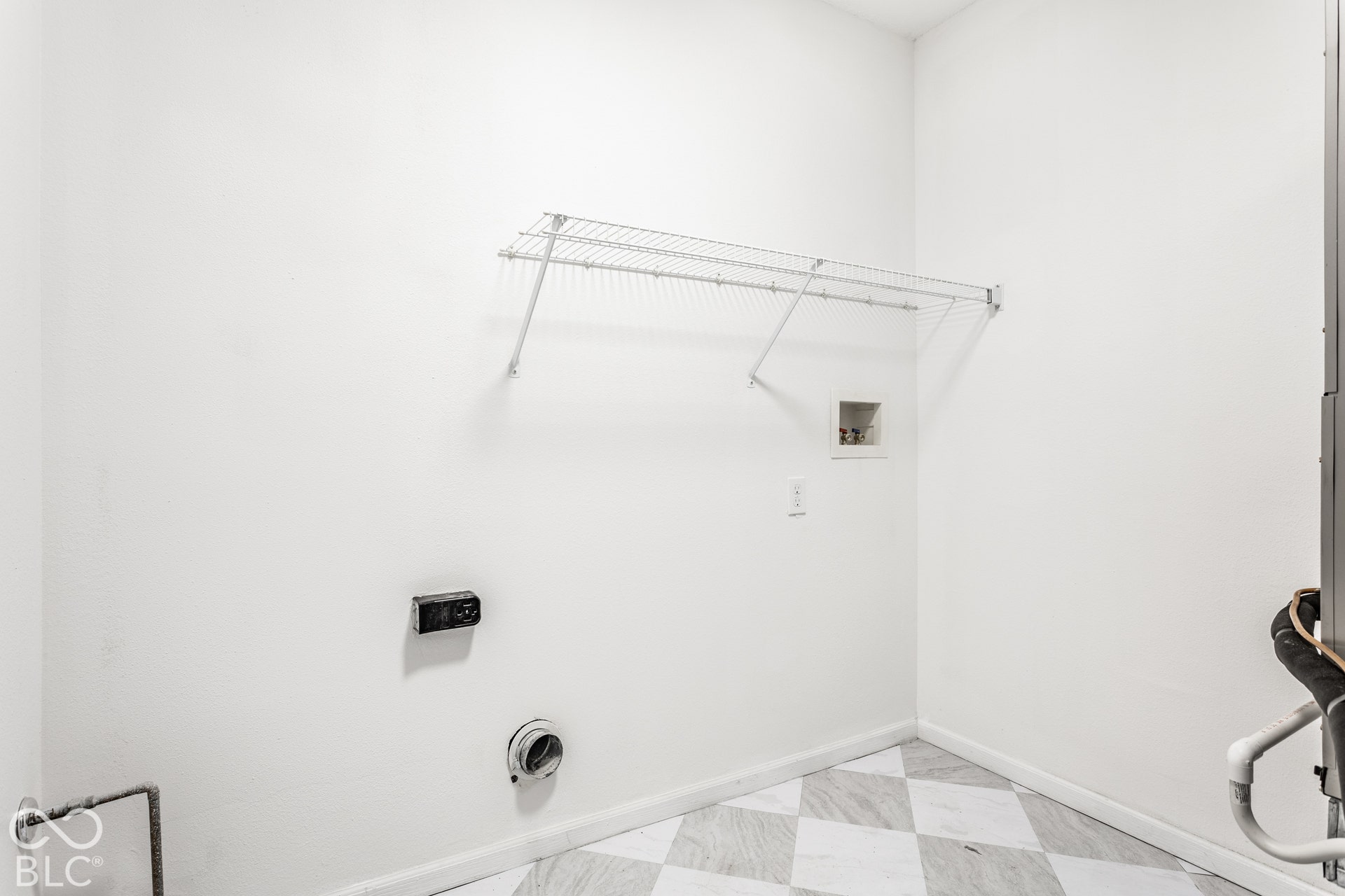 White walls complementing the checkered floor