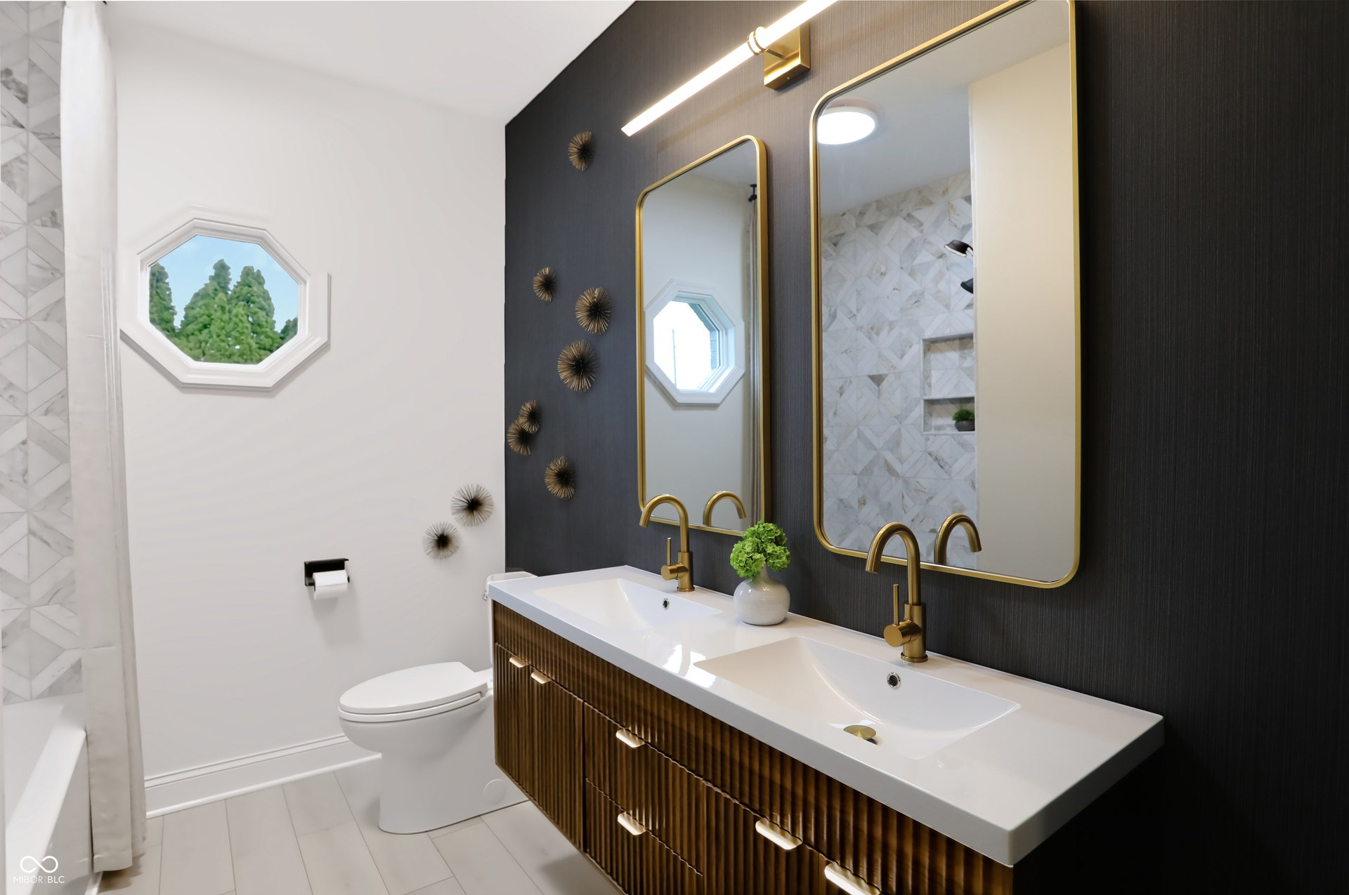 7405 Rooses Drive, Indianapolis, IN 46217 Dual vanity with integrated sinks, gold-finish faucets, and rectangular mirrors