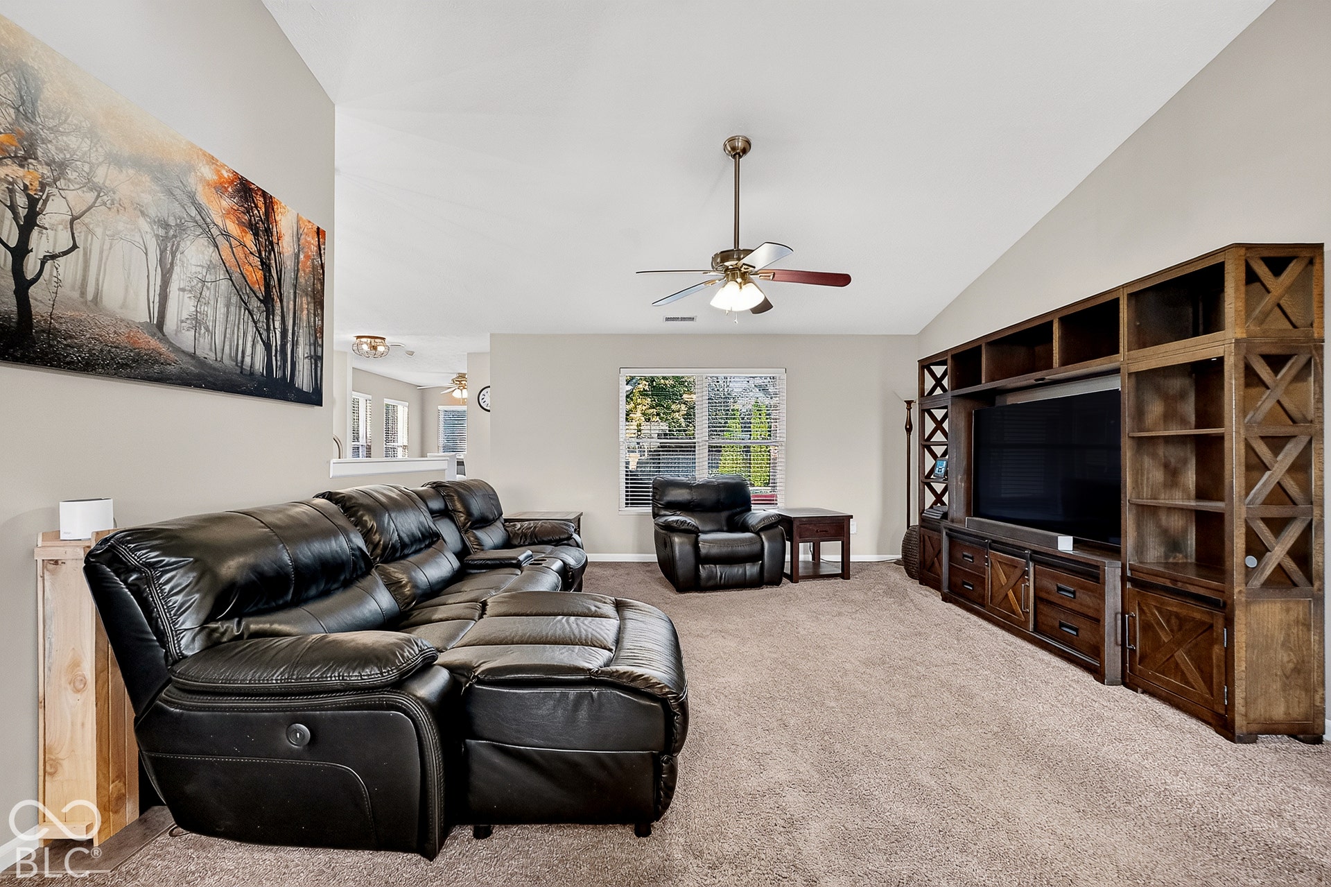 Vaulted ceiling with a ceiling fan