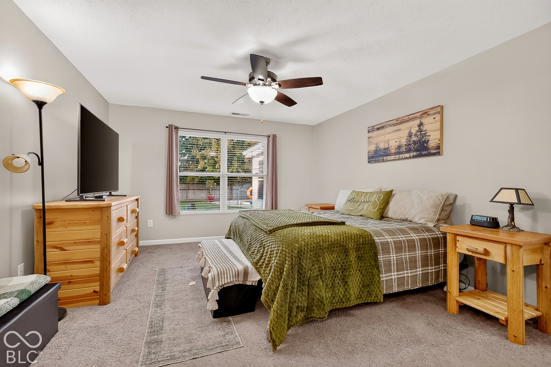 Carpeted flooring, window with blinds, ceiling fan, and light neutral wall paint