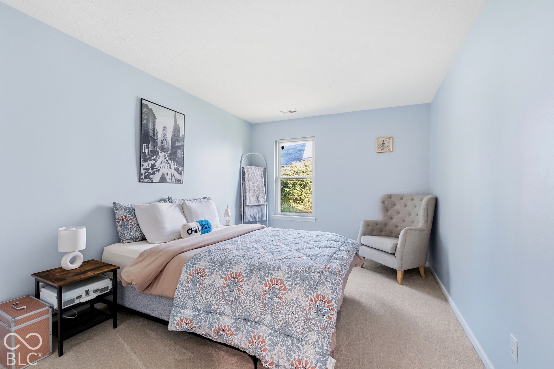 Light blue painted walls and neutral carpet