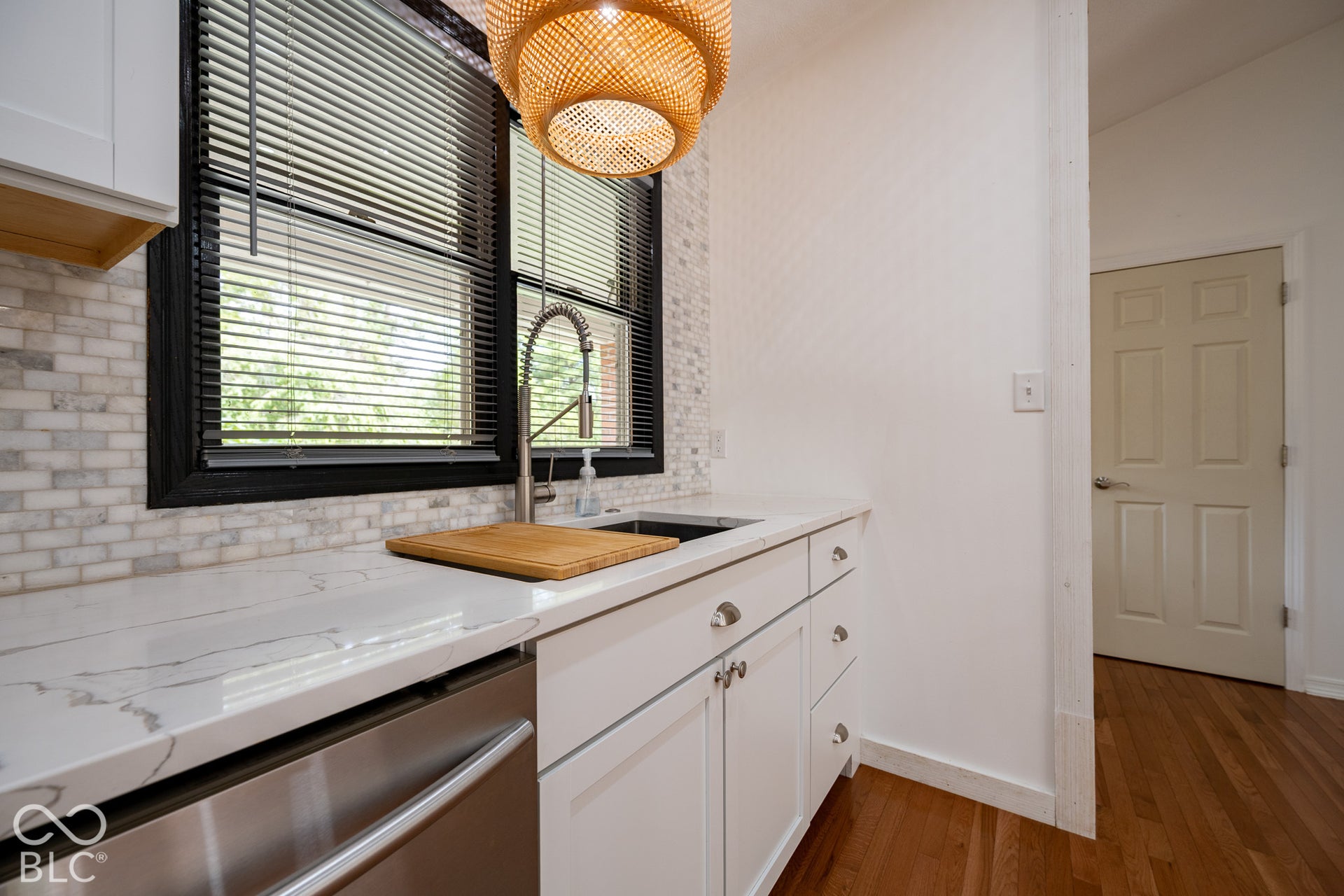 Pella windows throughout, quartz counter top and marble backsplash