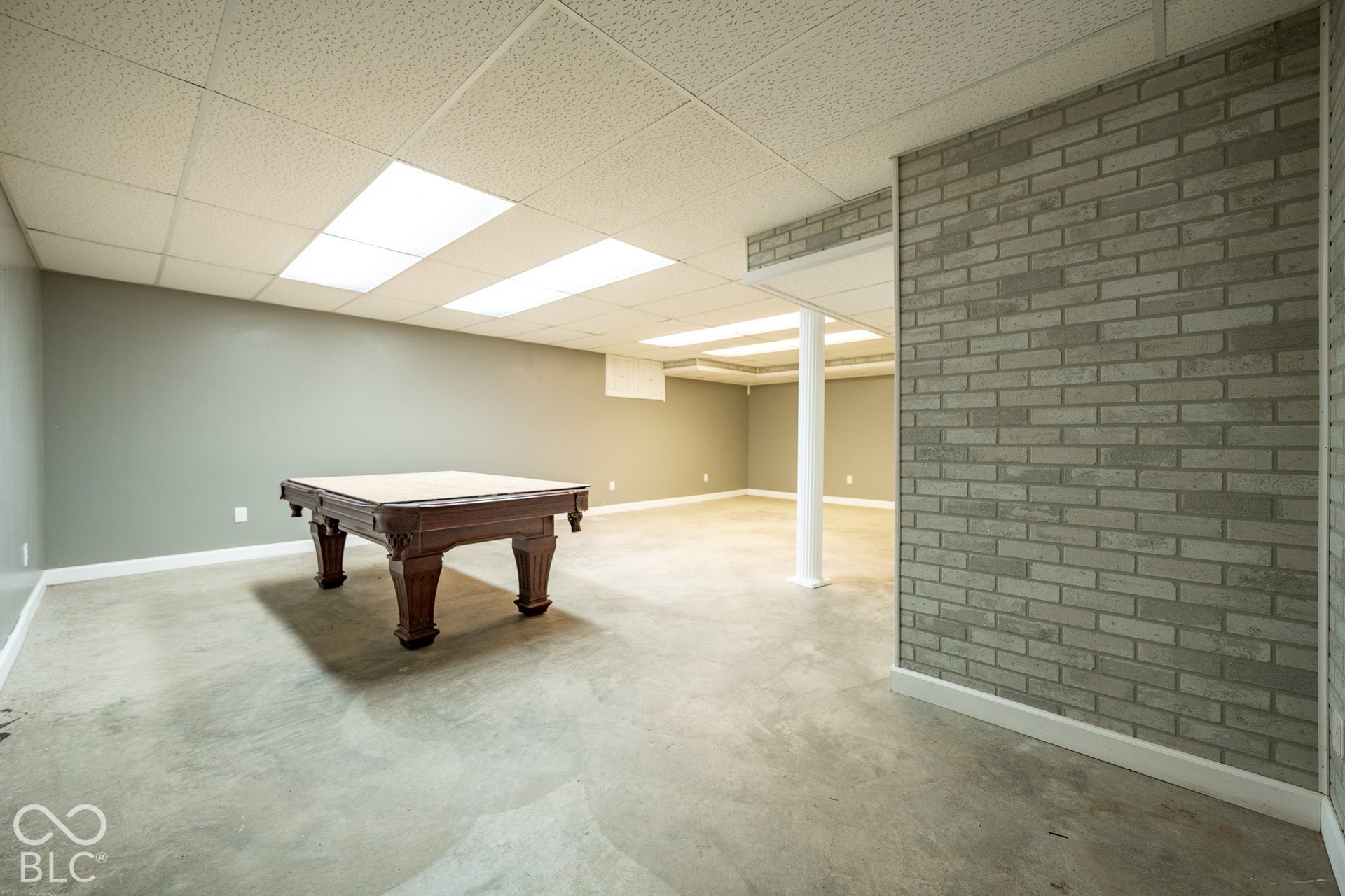 Pool table in the basement conveys with the property