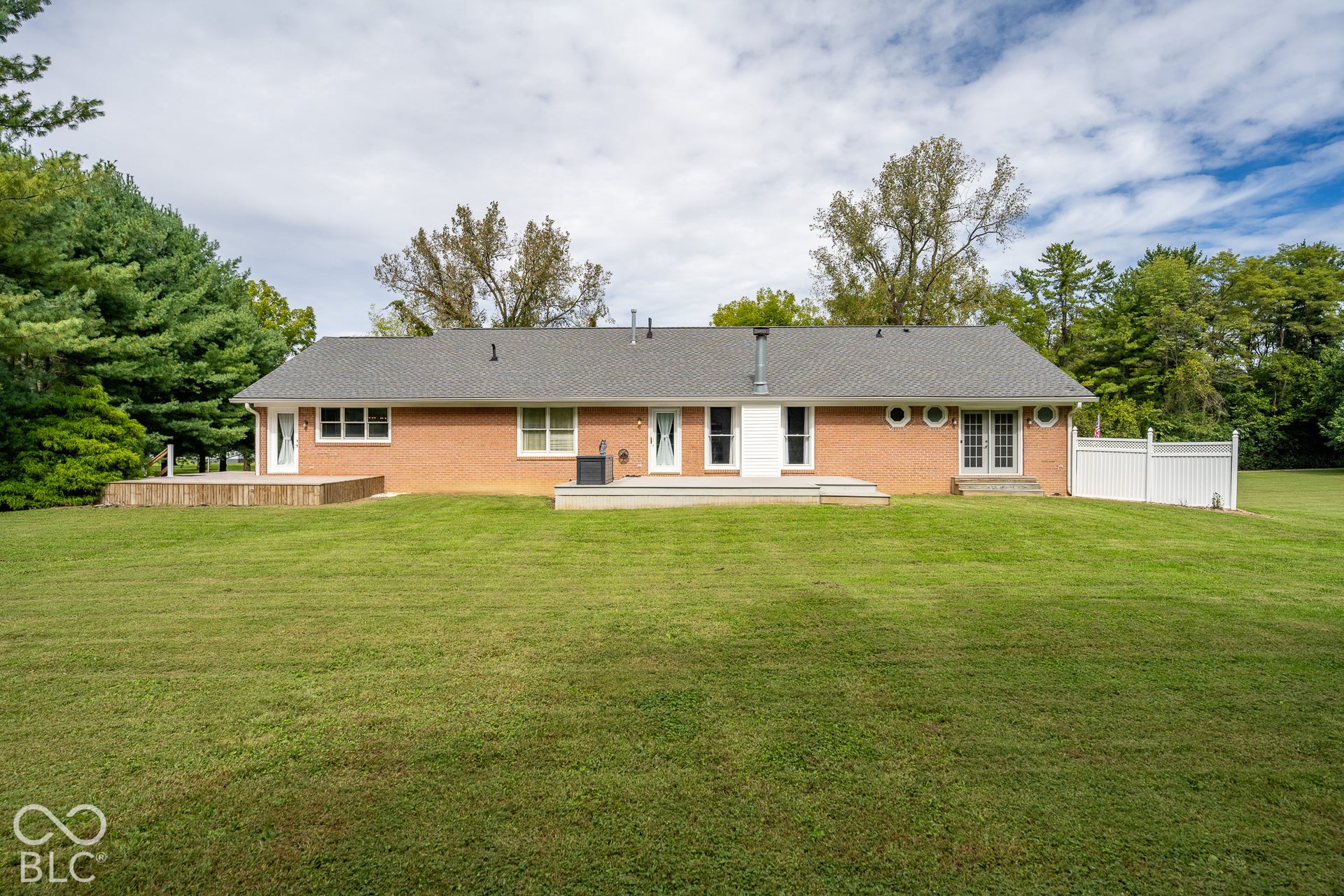 This shows the back side of the home, the inlaw suite has its own private deck off to the left of the photo