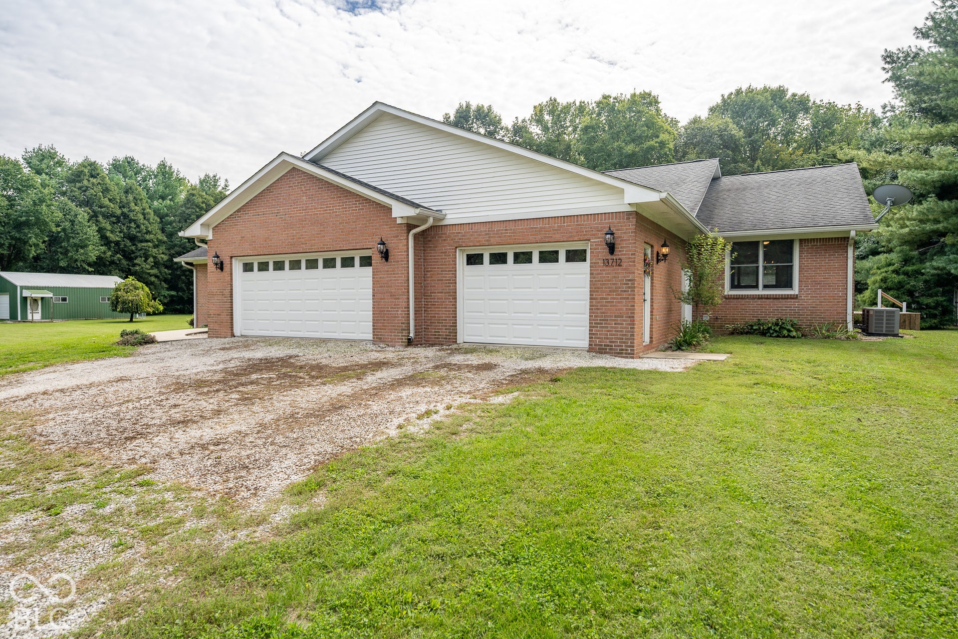 2 car garage for the main part of the home and a separate single car garage with an extra wide door for the in-law suite