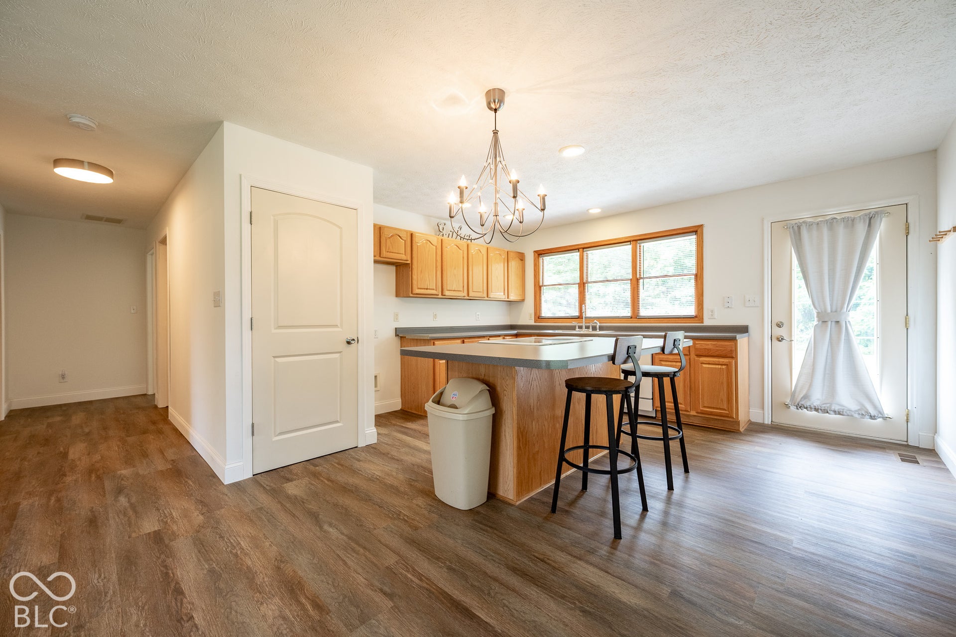 large island in the kitchen that looks out the back deck, these appliances in the in-law suite also stay