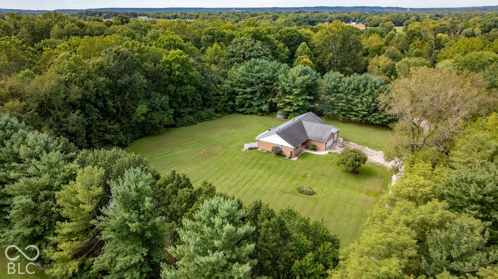 The two acres is completely surrounded by conifers. The tree line is the property line